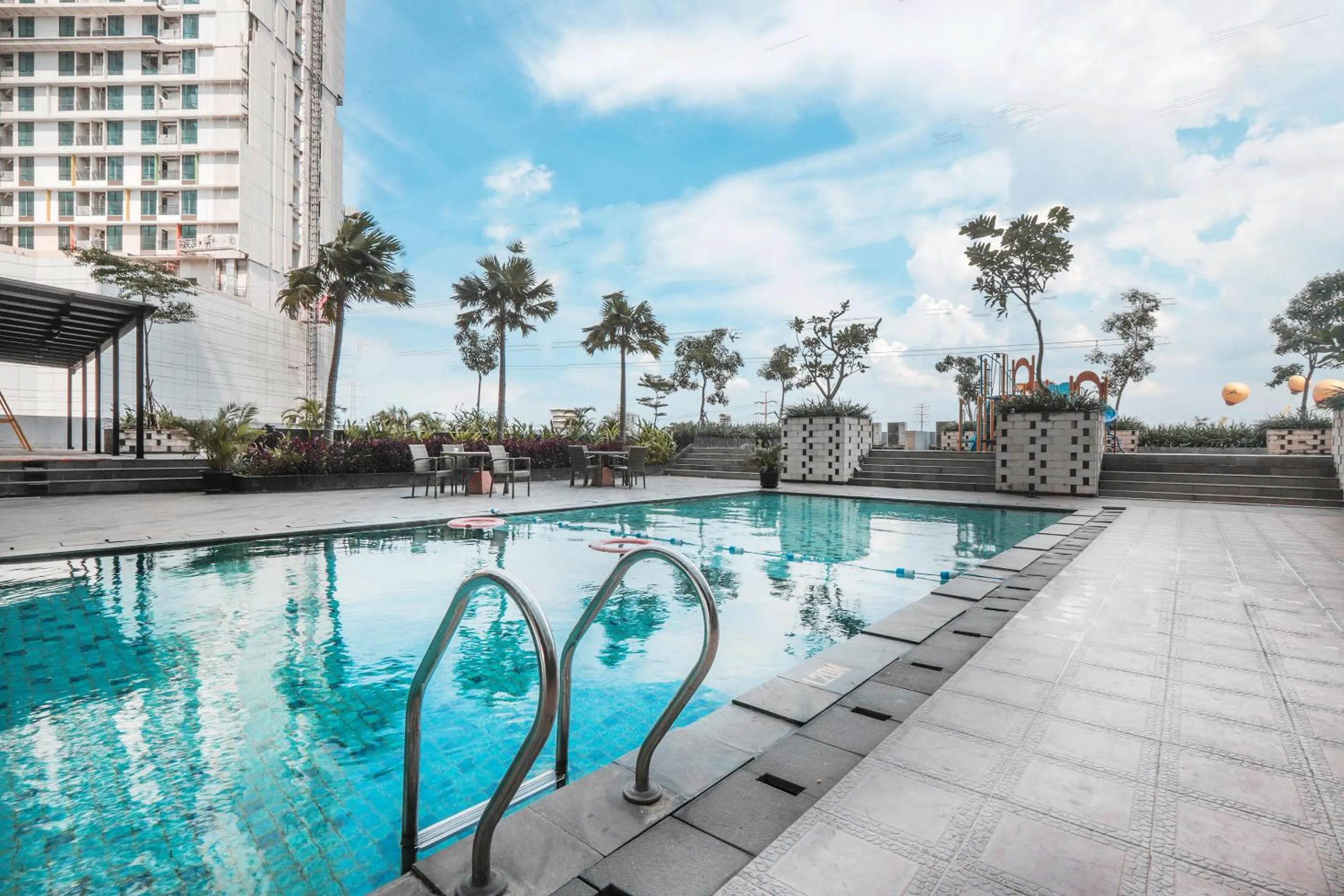 Swimming Pool in OYO  Flagship 755 Appartel Grand Dhika City