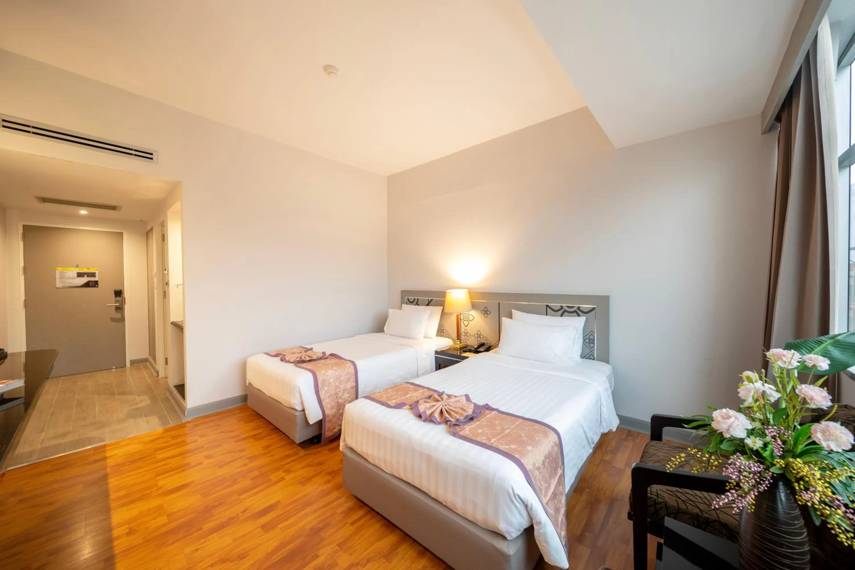 Bed in New Season Hotel