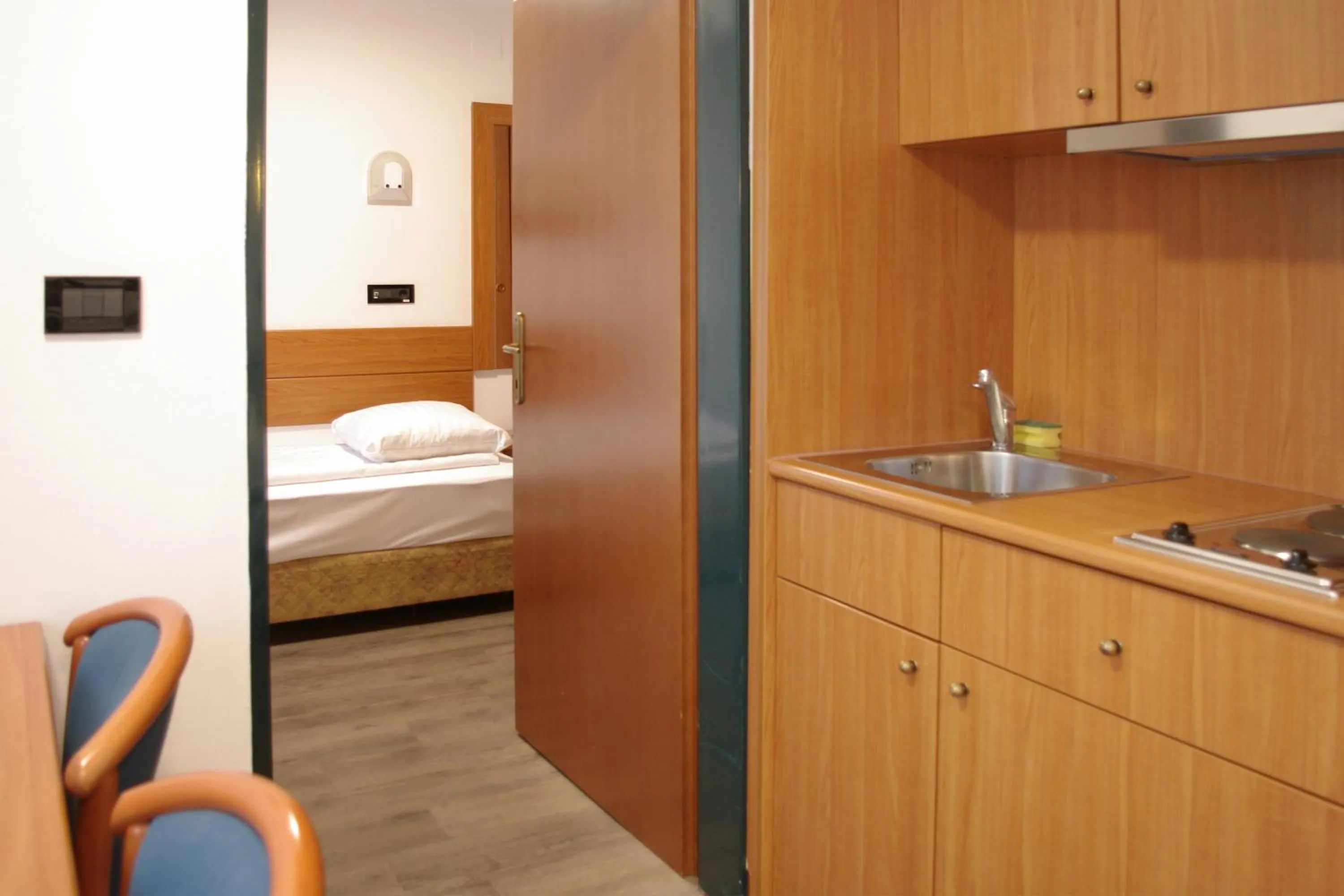 Kitchen or kitchenette, Bed in Sabotin, Hotel & Restaurant