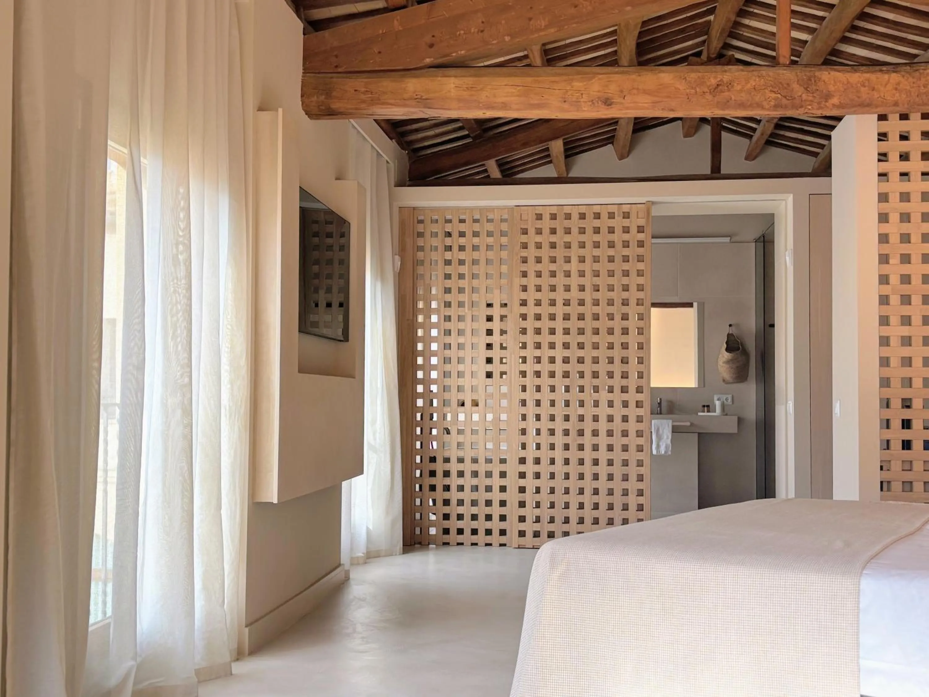 Bed in Les Clarisses Boutique Hotel