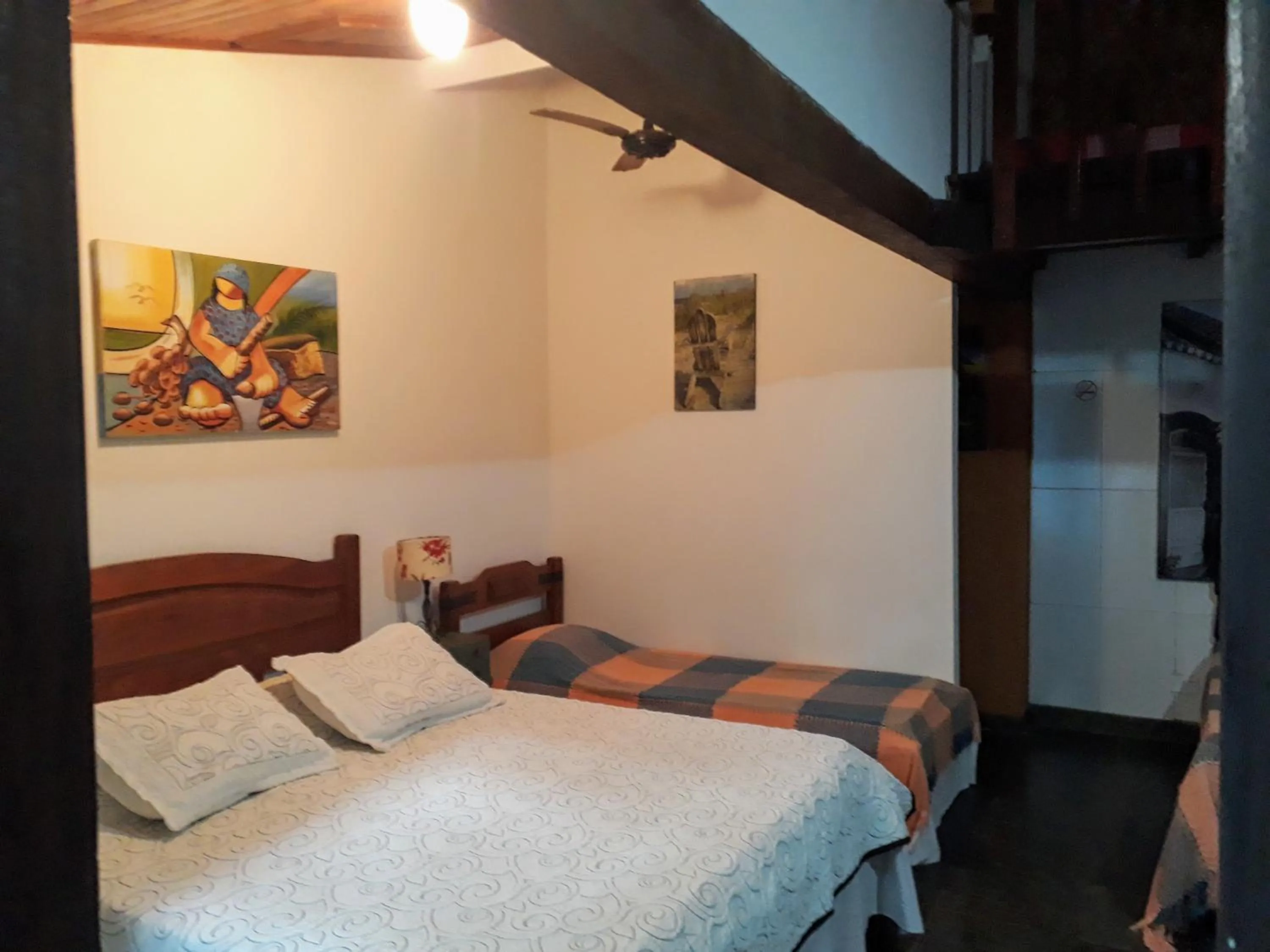 Photo of the whole room in Pousada Arte Colonial - Casarão Histórico do Séc XVIII - Lancha Própria