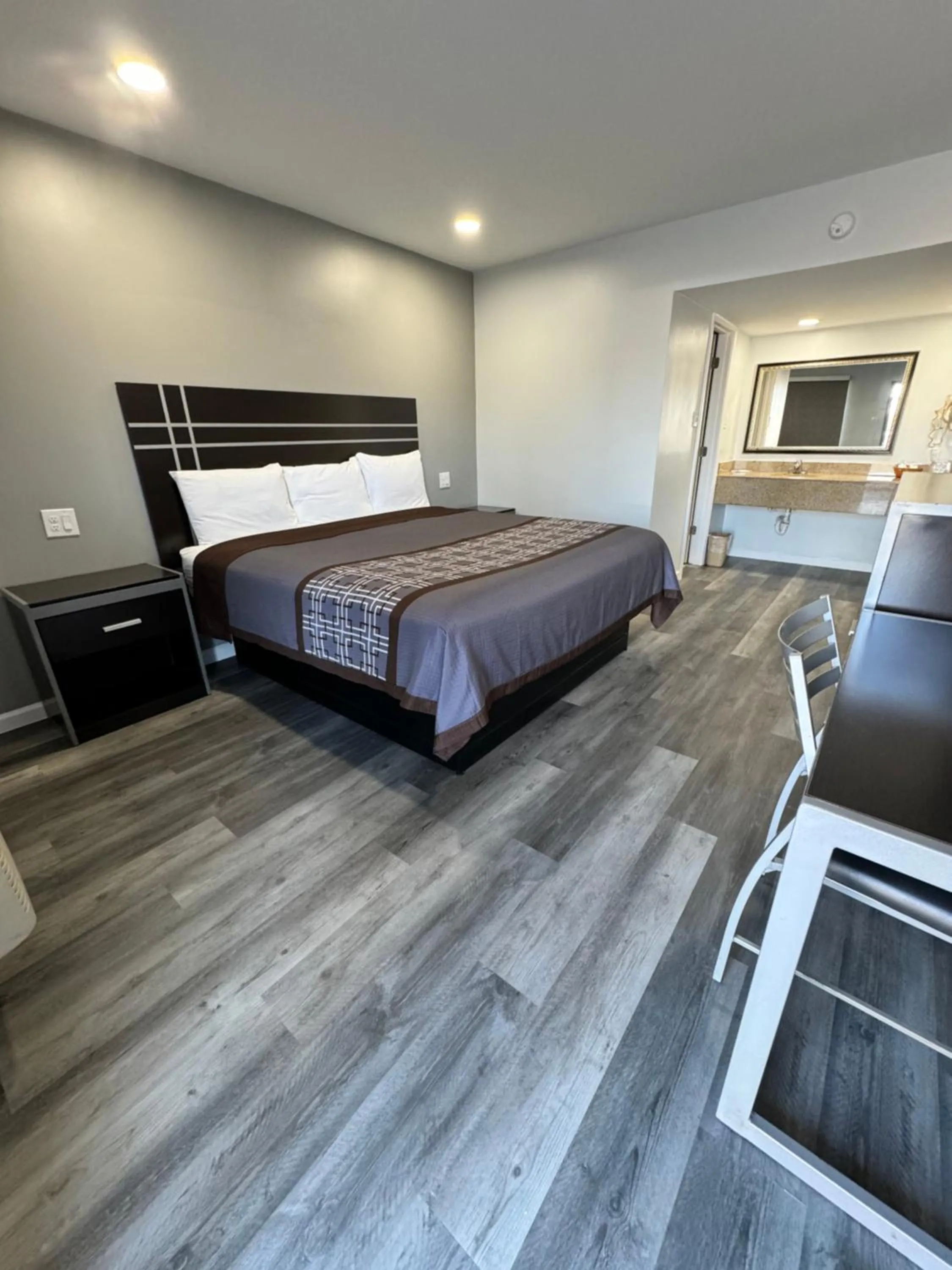 Bed in Continental Inn and Suites Nacogdoches TX SFA University Downtown