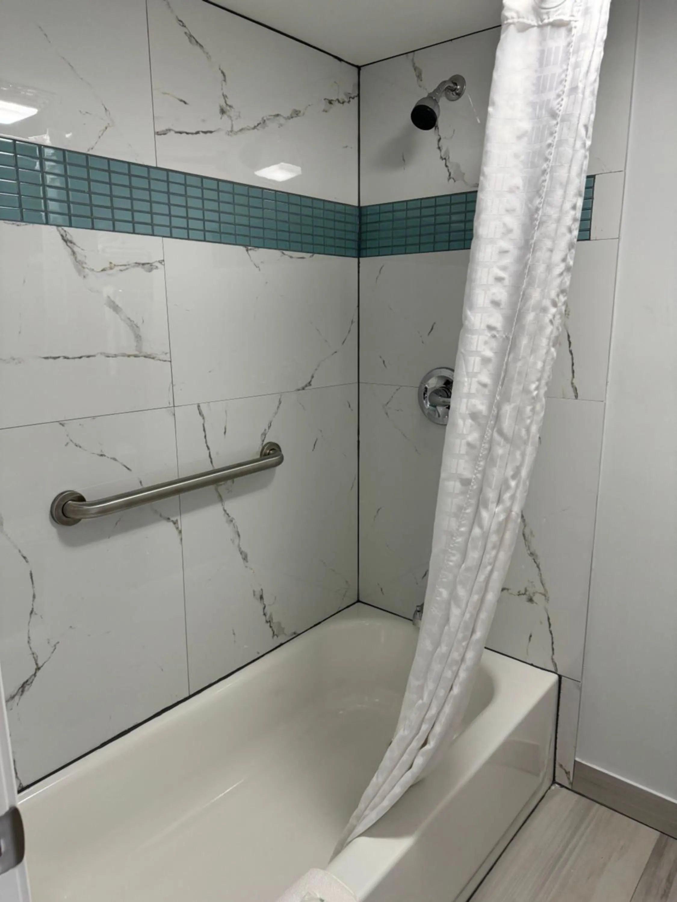 Shower in Continental Inn and Suites Nacogdoches TX SFA University Downtown