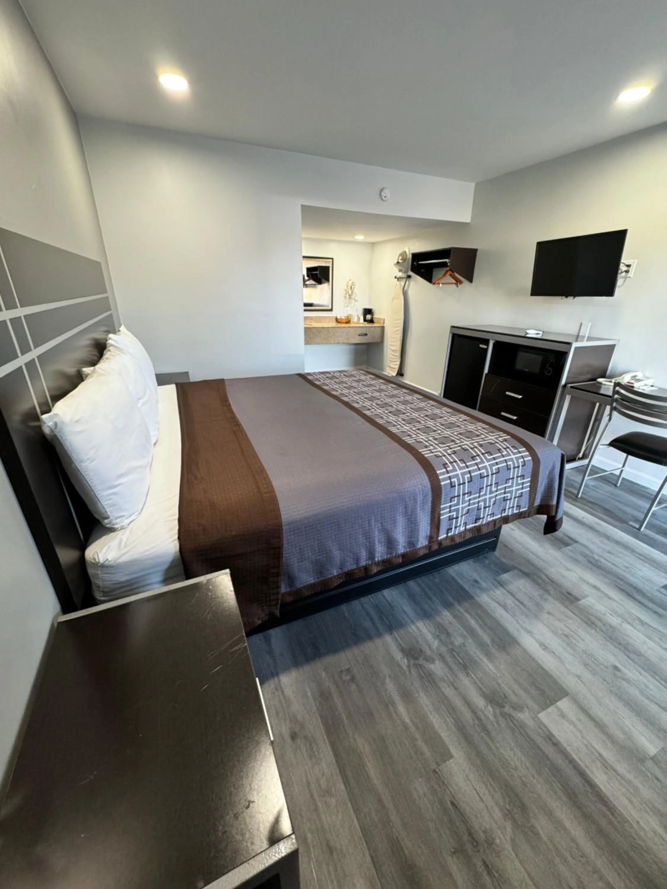 Bed in Continental Inn and Suites Nacogdoches TX SFA University Downtown