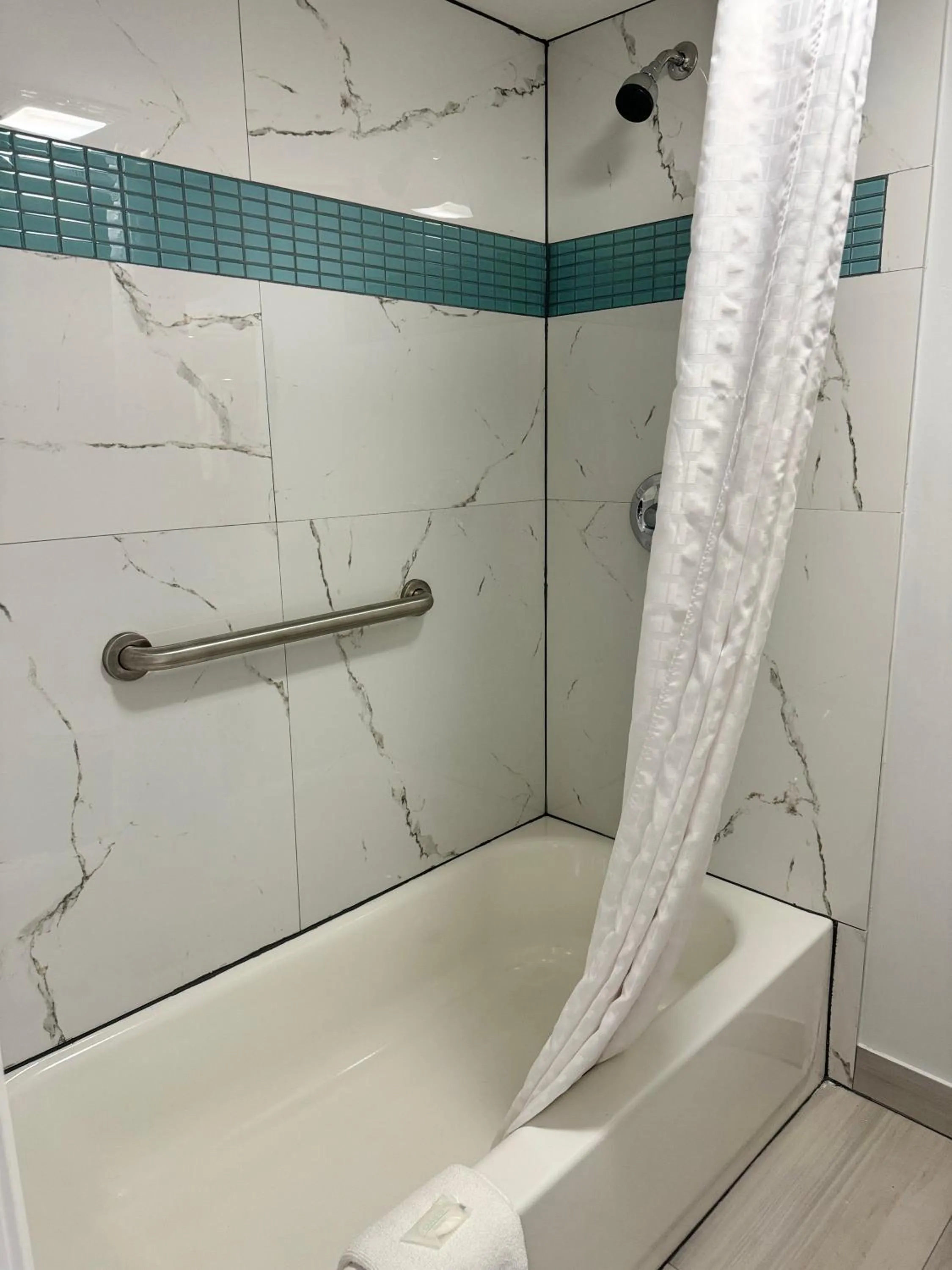 Shower in Continental Inn and Suites Nacogdoches TX SFA University Downtown