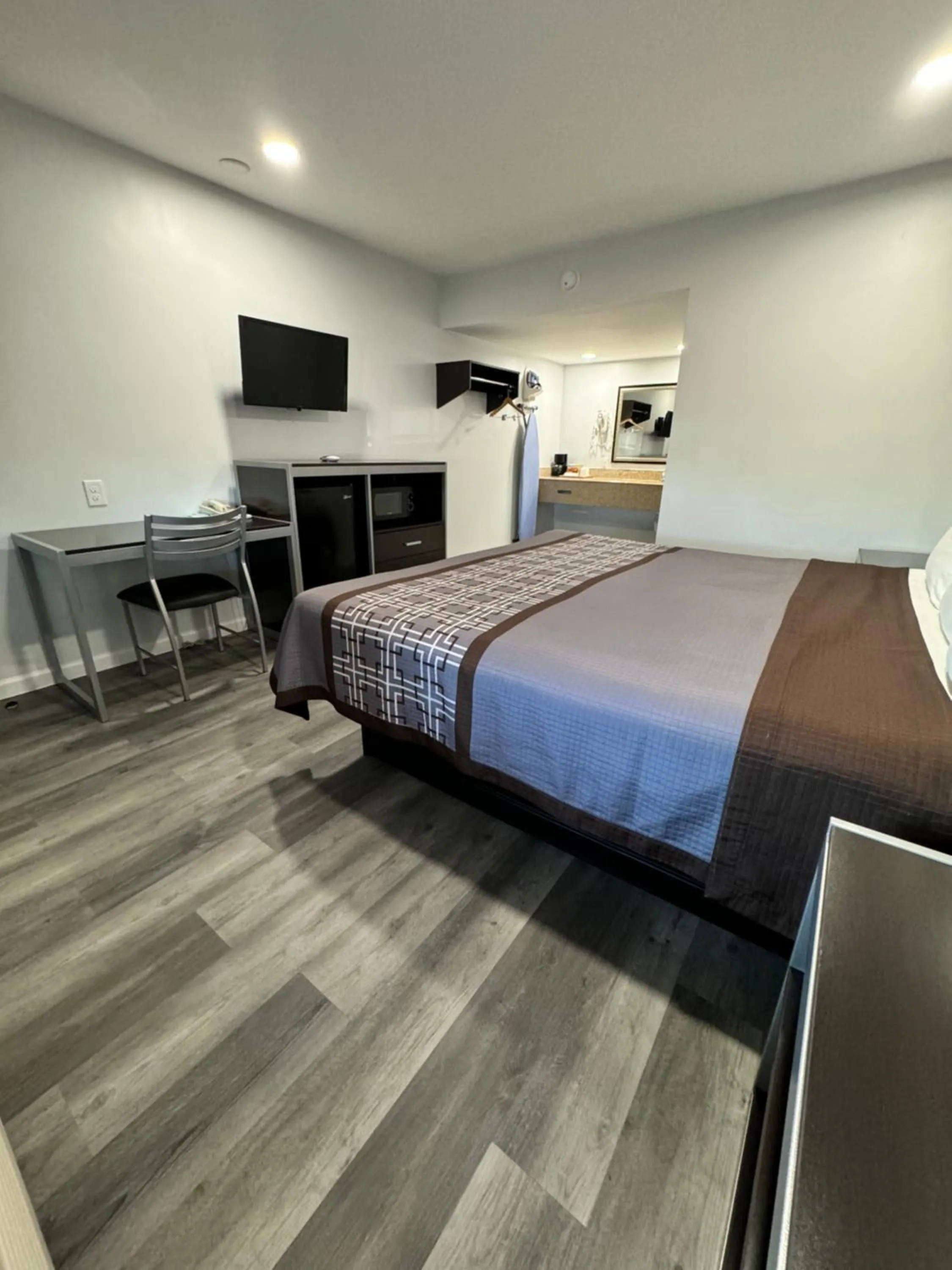 Bed in Continental Inn and Suites Nacogdoches TX SFA University Downtown