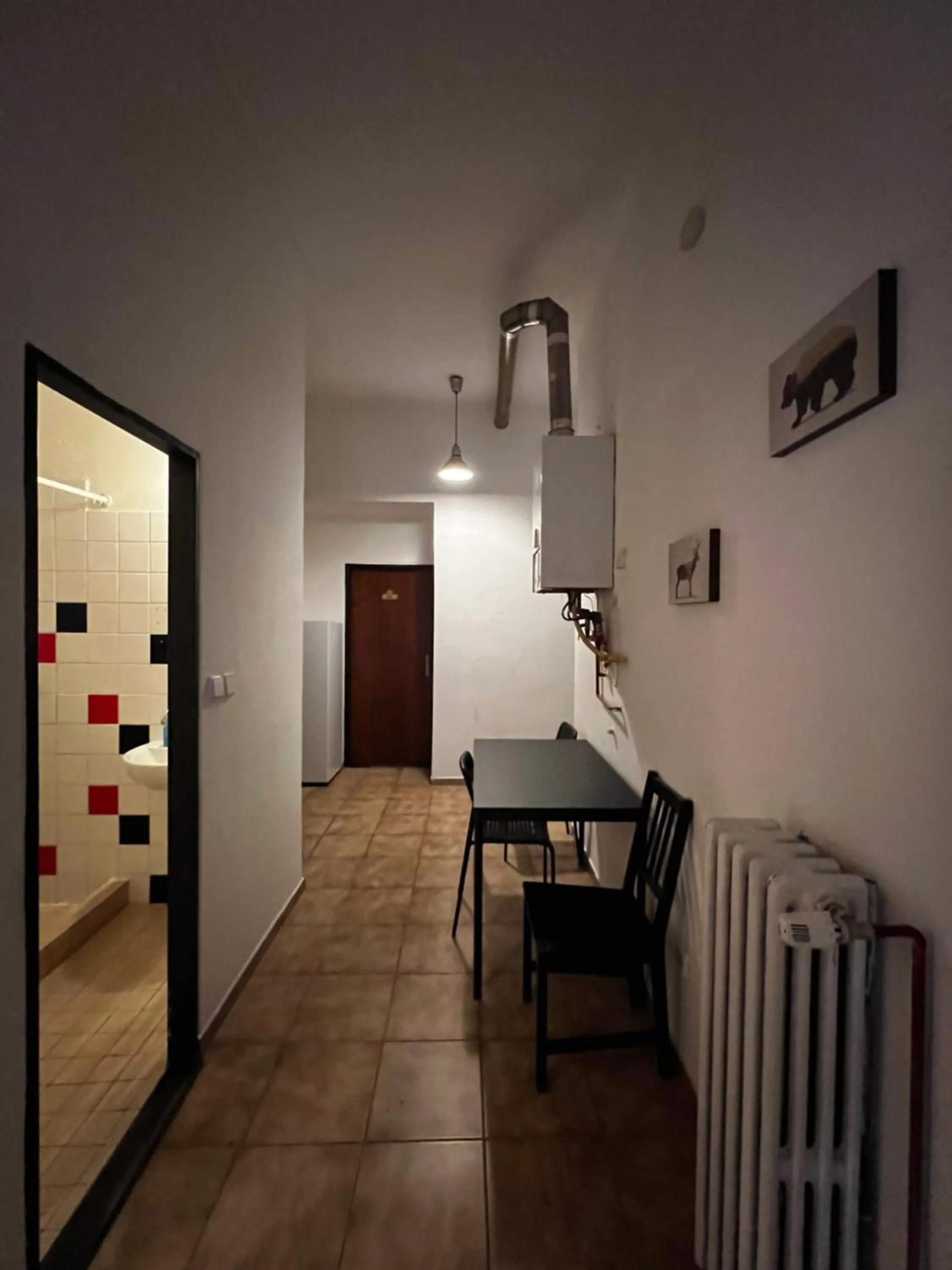 Communal kitchen in Clown and Bard Hostel