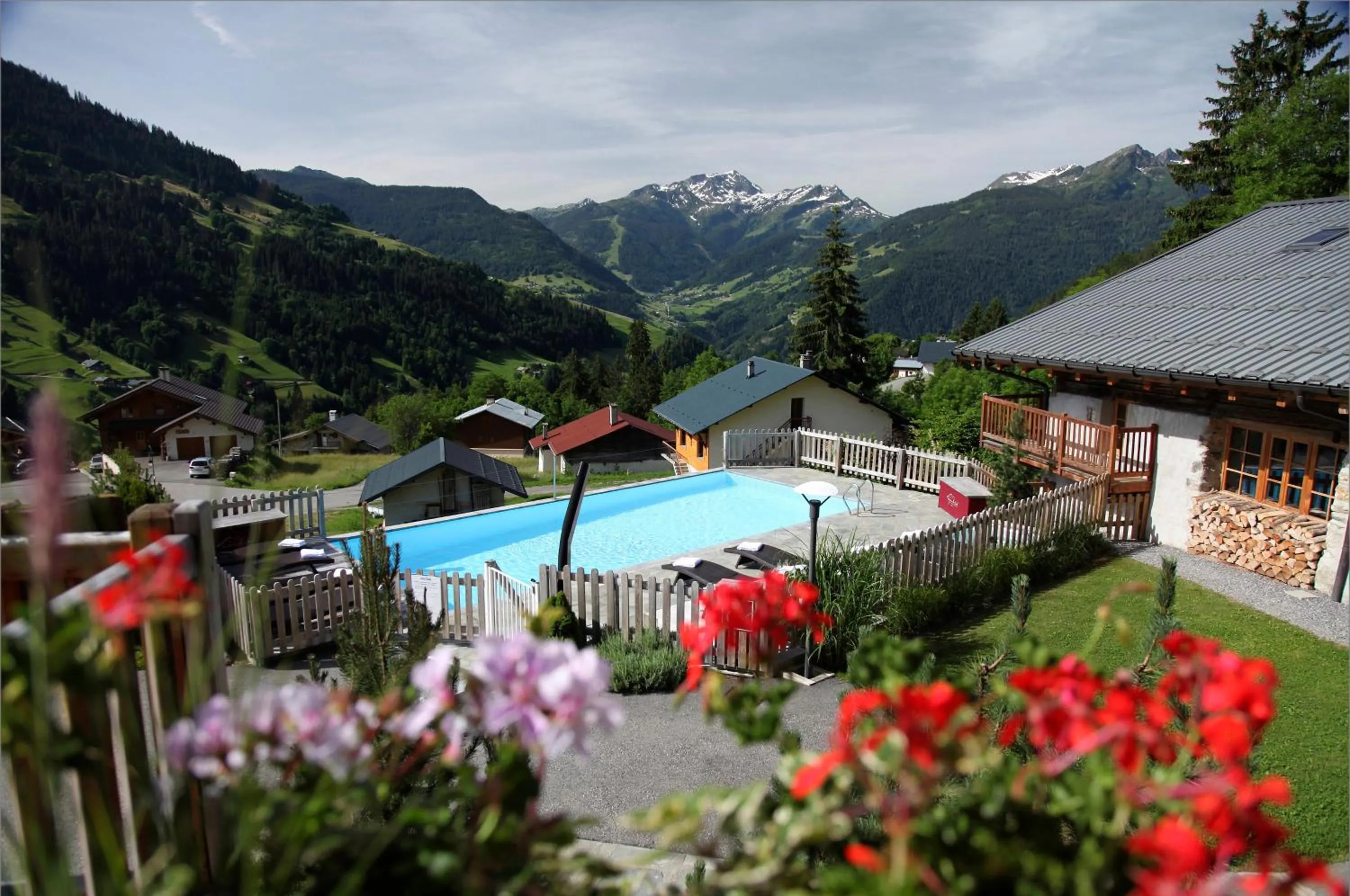 Swimming pool in Hôtel La Ferme du Chozal, Chalet de tradition