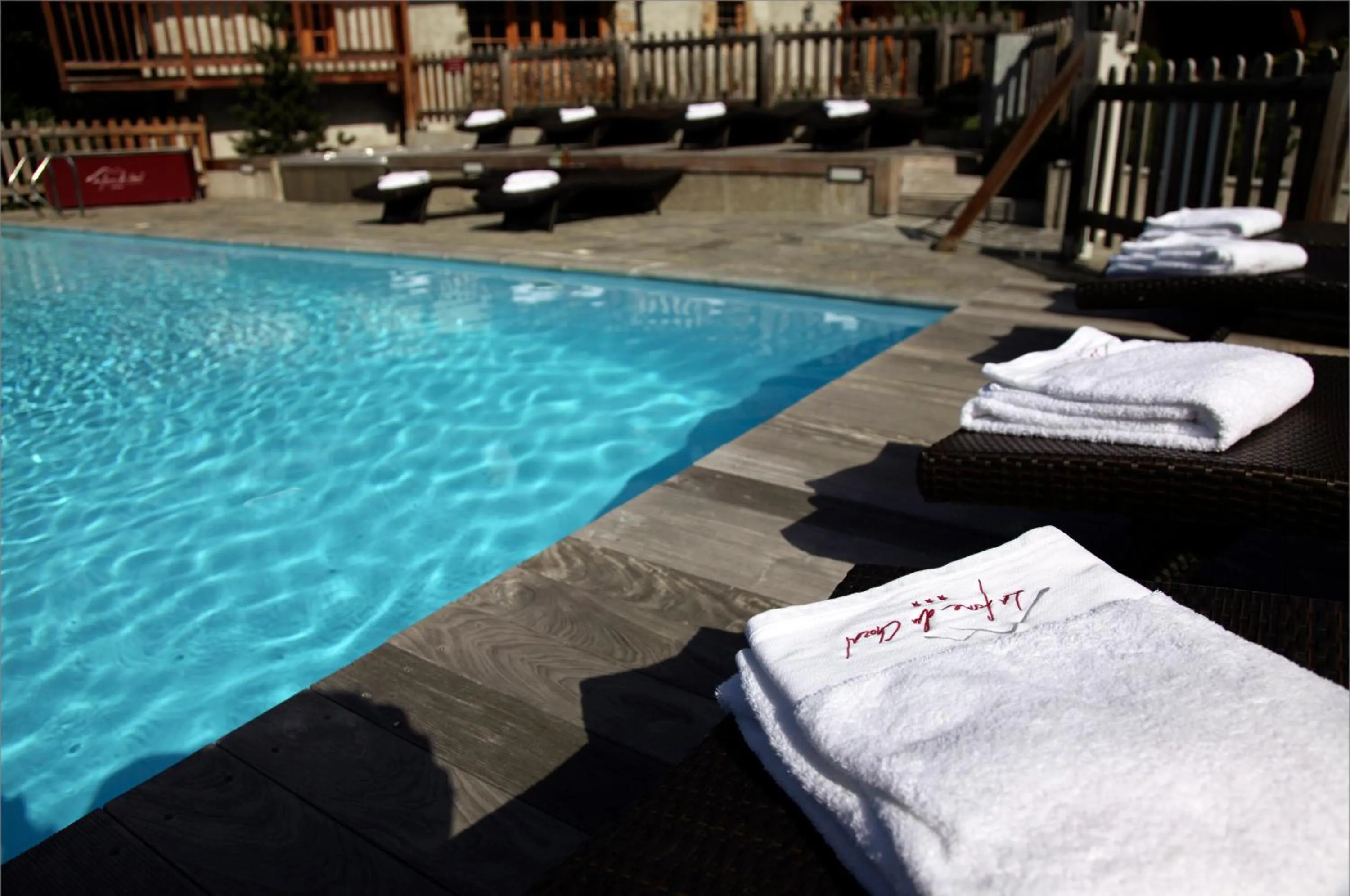 Swimming pool in Hôtel La Ferme du Chozal, Chalet de tradition