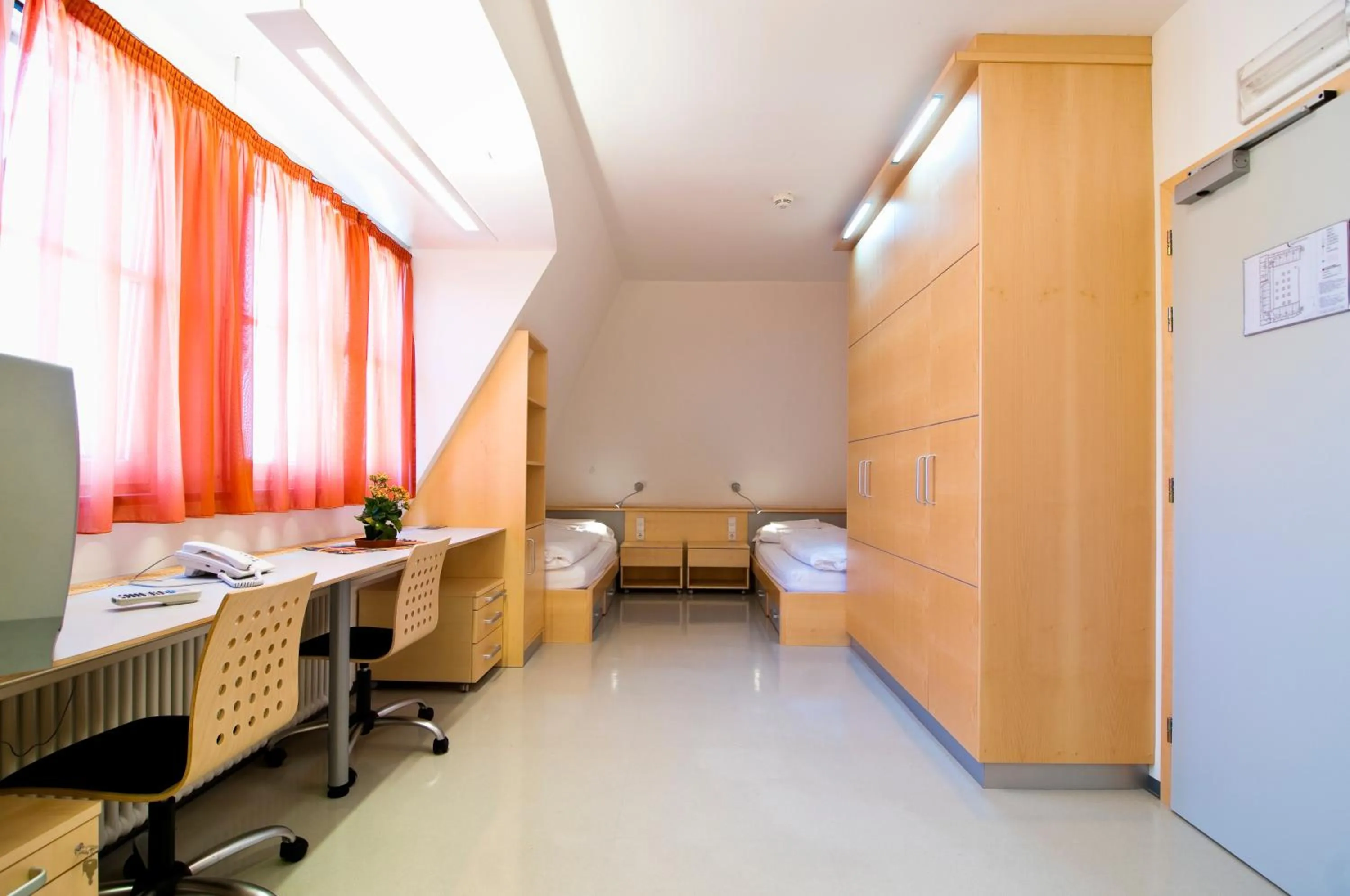 Photo of the whole room, Bed in Kolpinghaus Bolzano