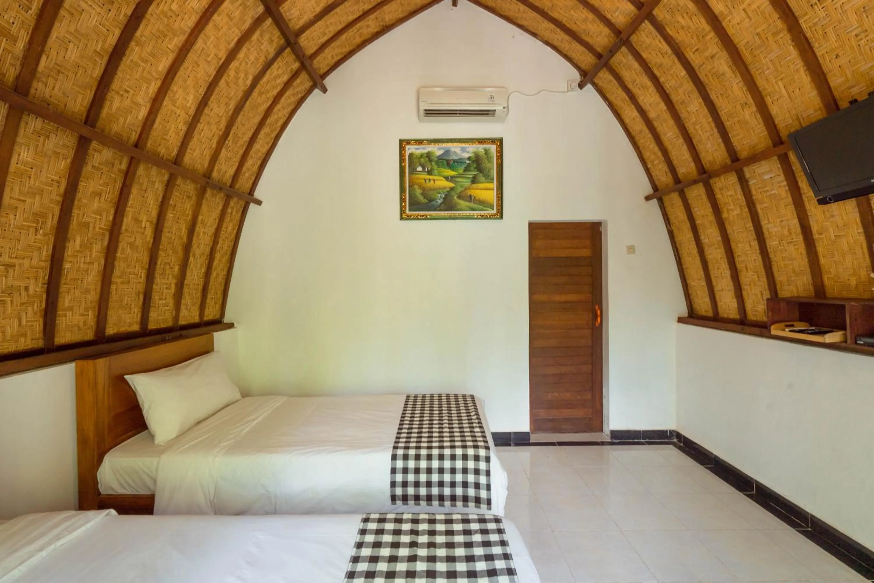 Bedroom, Bed in Ratu Cottage by OurStory Travels