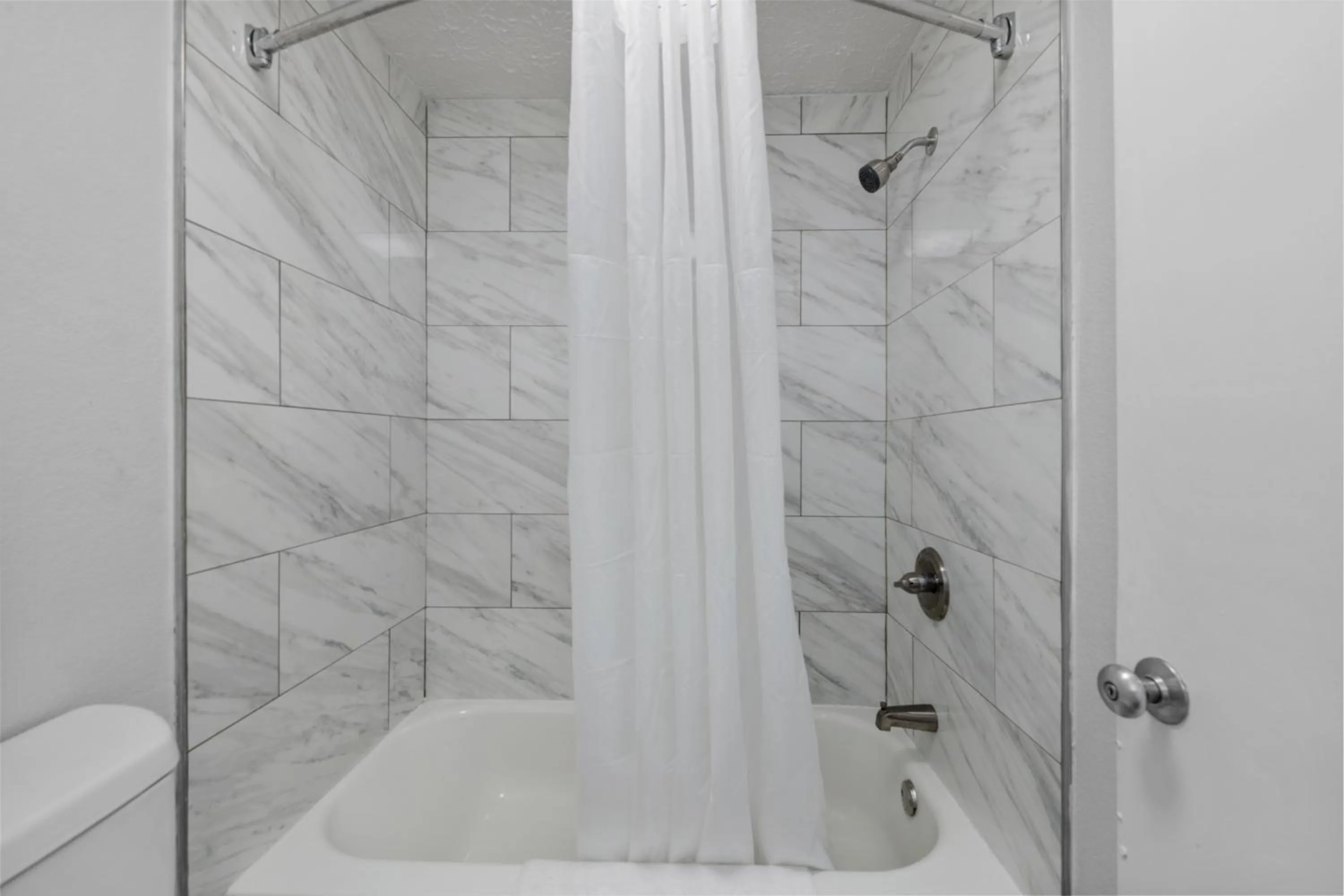 Shower in Budget Inn-Norfolk, VA - Oceanview