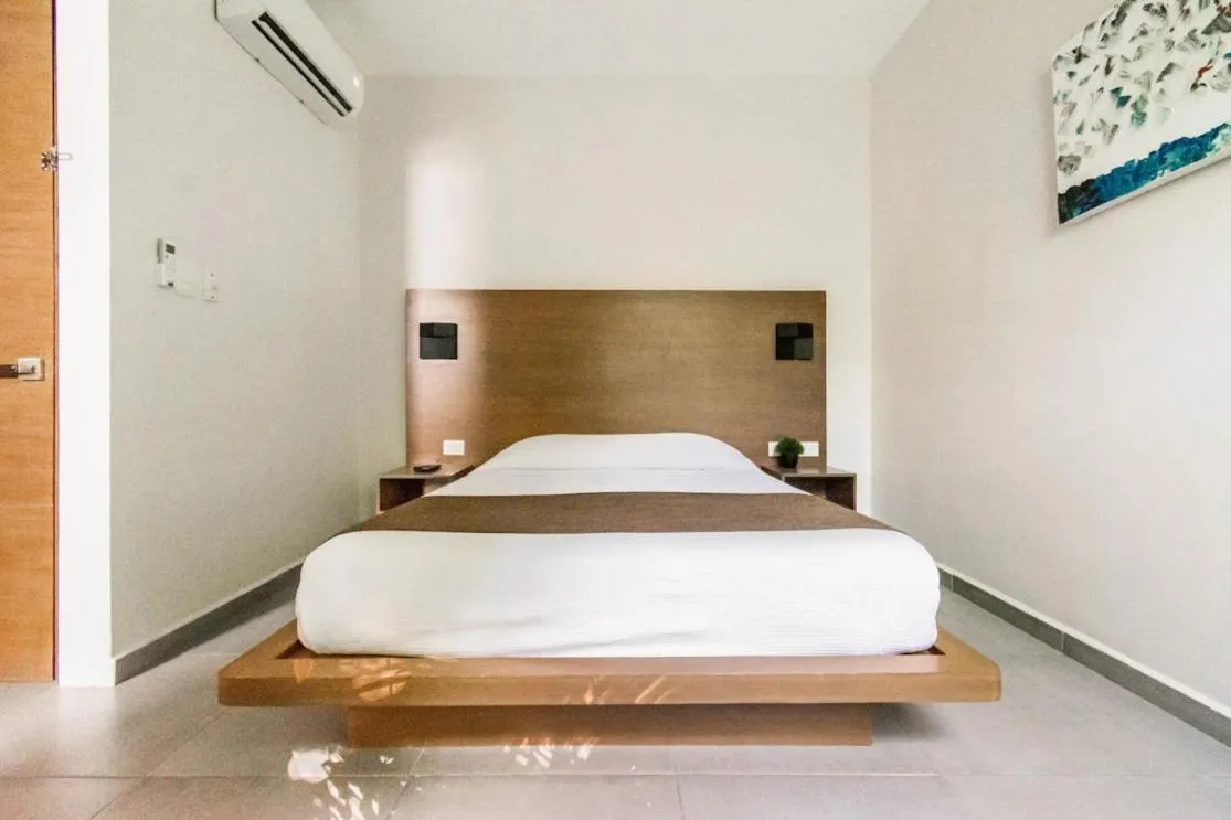 Bed in Viento Suites Cancún