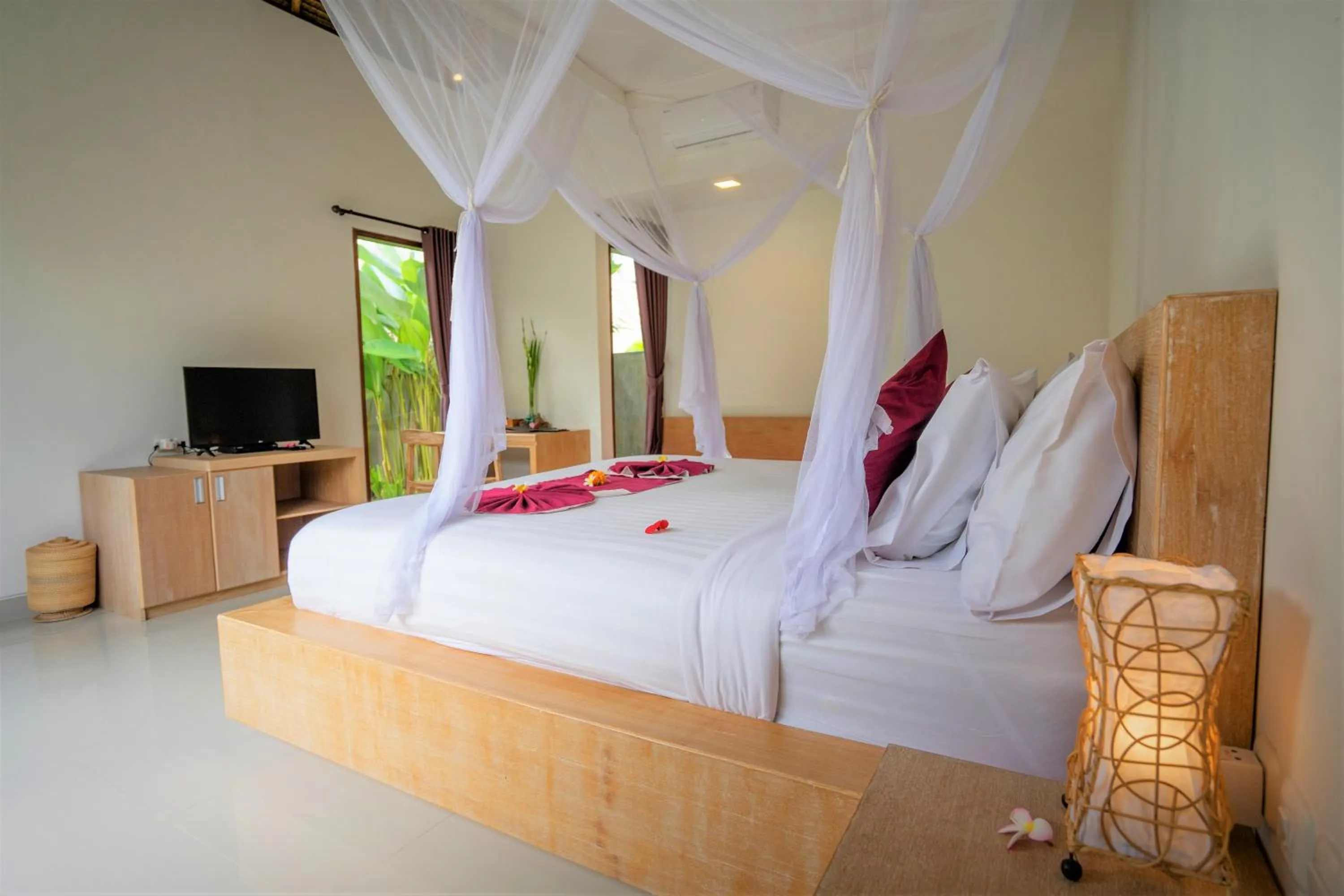 Bed in Three Gold Luxury Private Villas