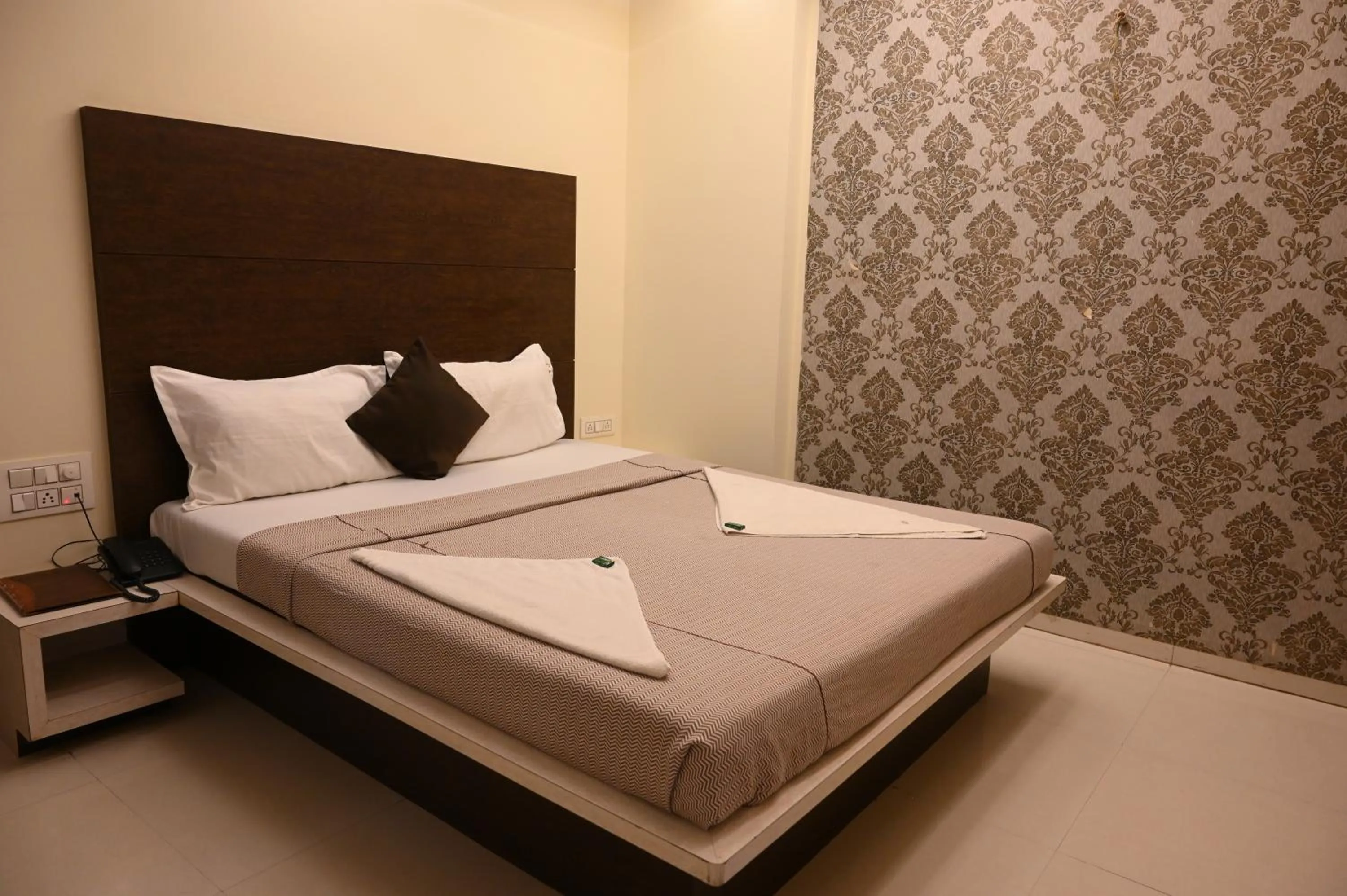 Bed in Hotel Ramkrishna Inn