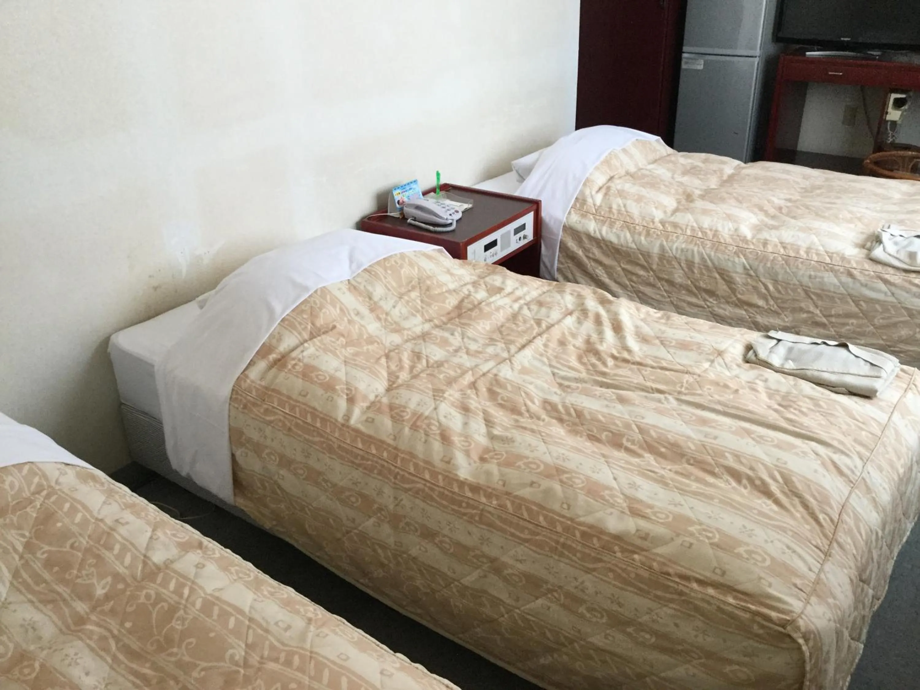 Bed in Hotel Peace Land Ishigaki