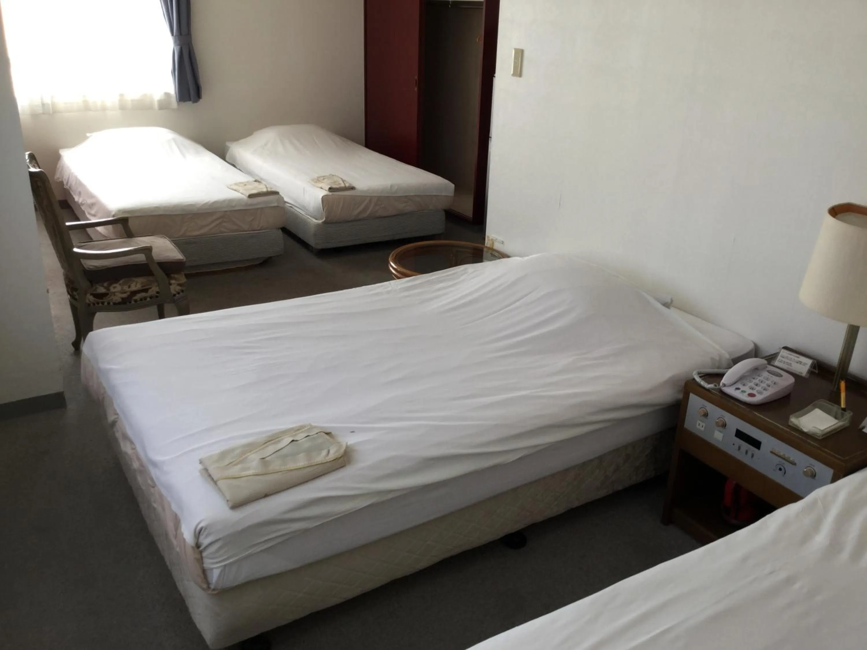 Bed in Hotel Peace Land Ishigaki