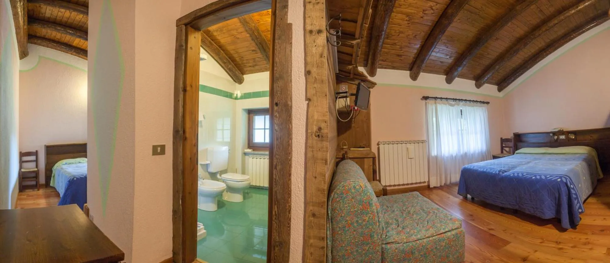 Photo of the whole room, Bed in Albergo Boule de Neige