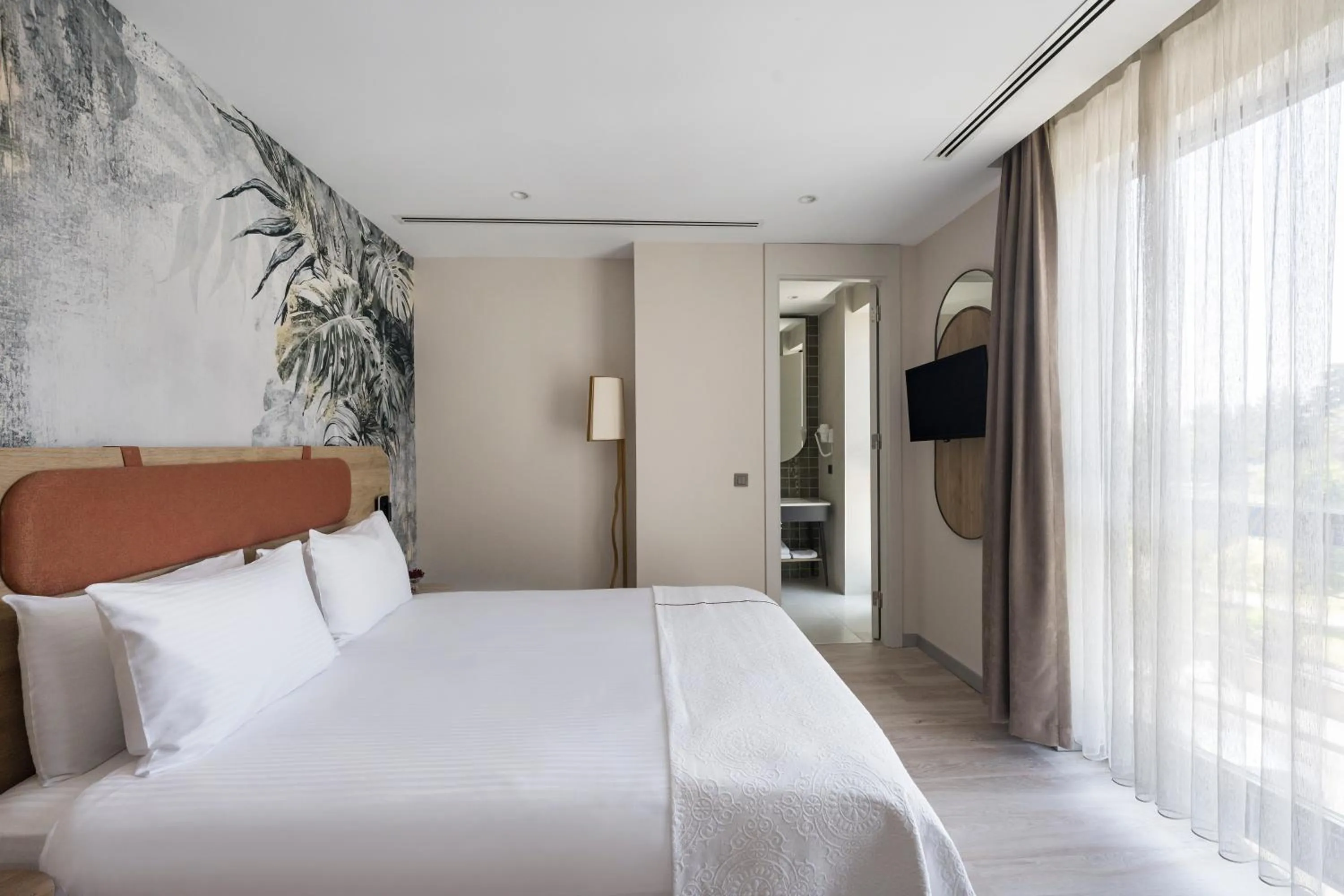 Bed in Upsuites Hotel