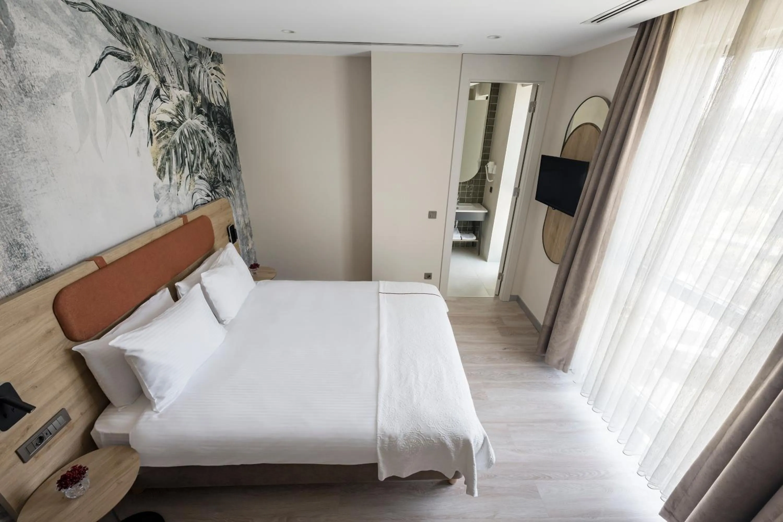 Bed in Upsuites Hotel