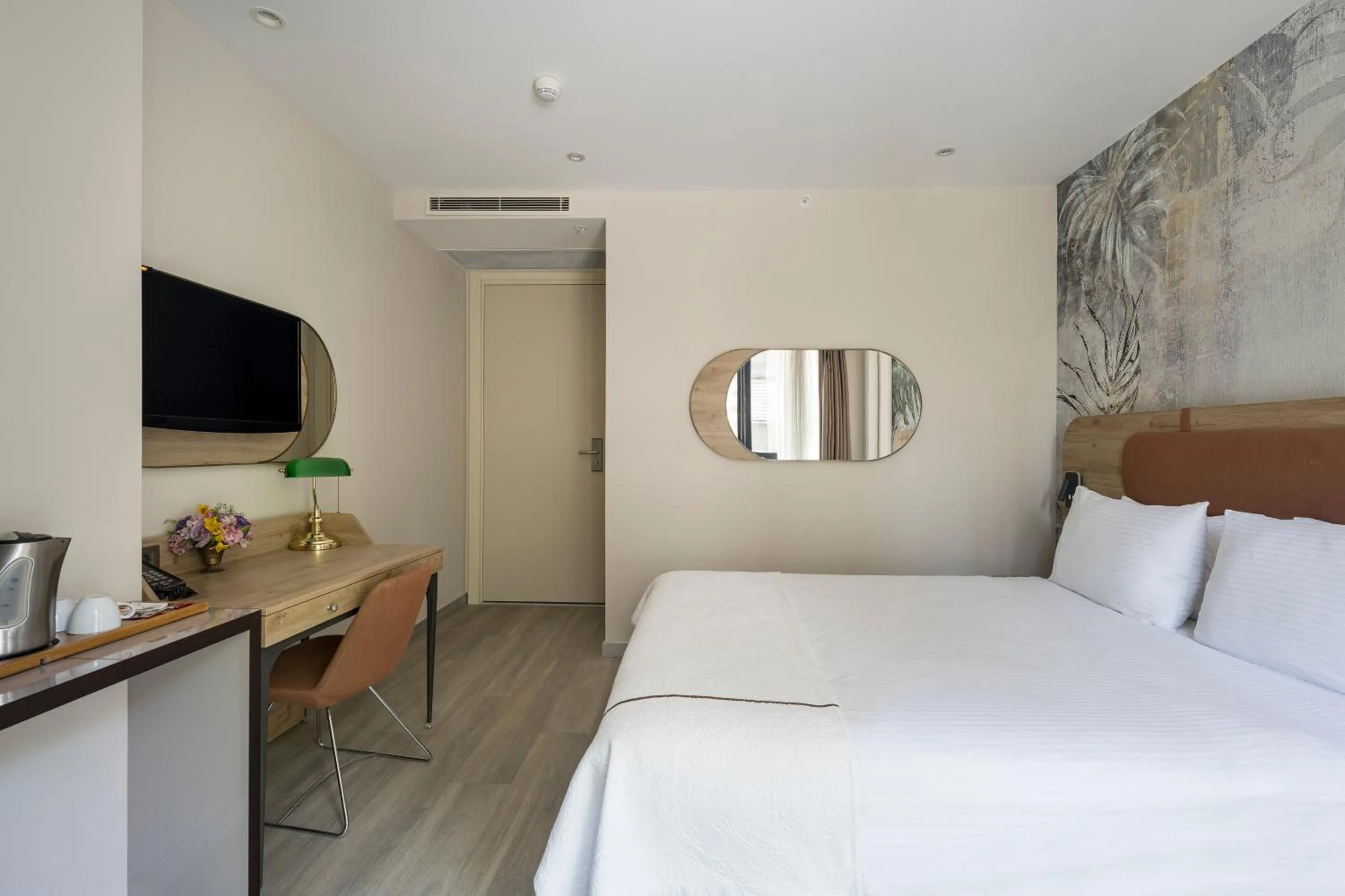 Bed in Upsuites Hotel