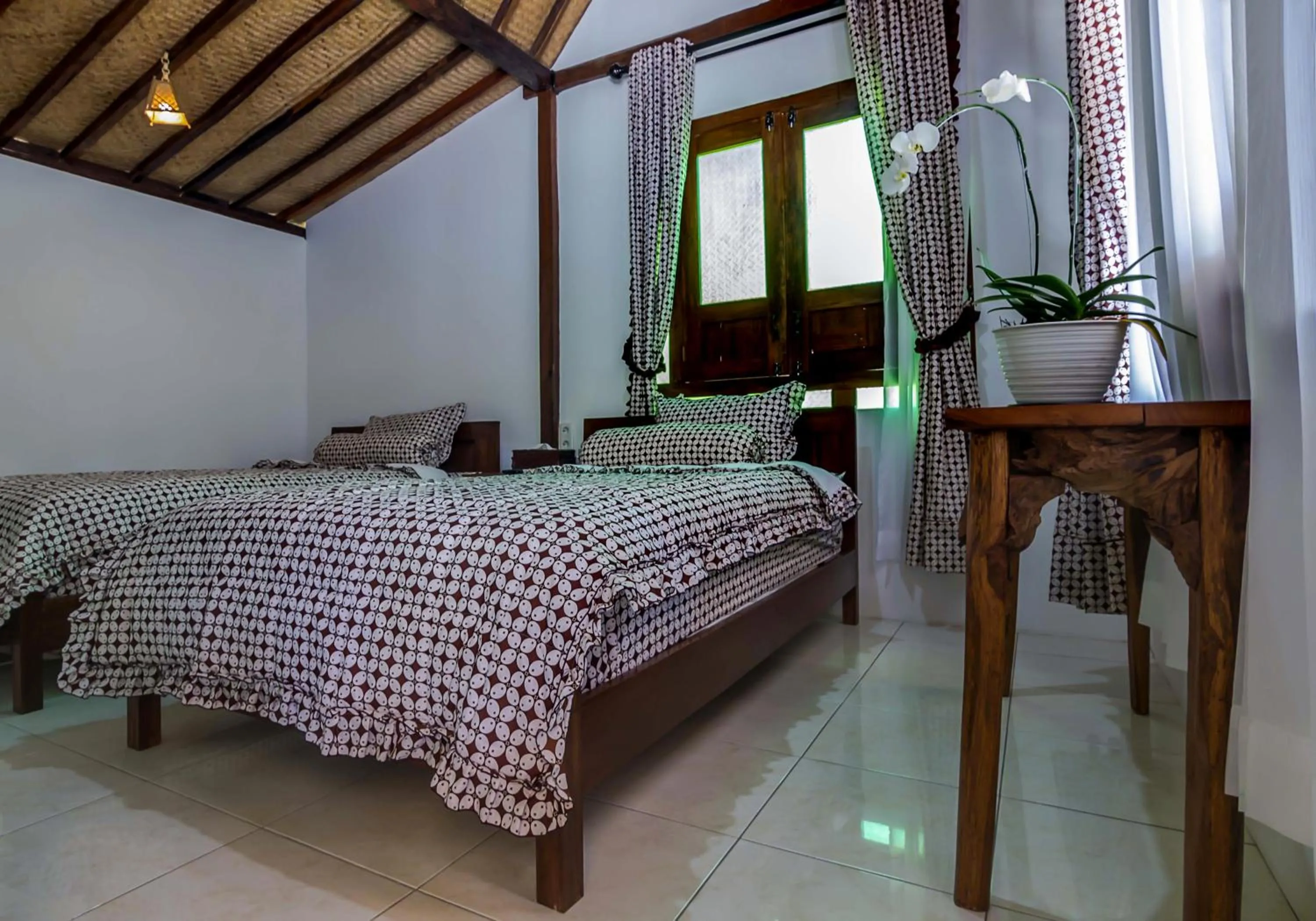 Bed in The Omah Borobudur