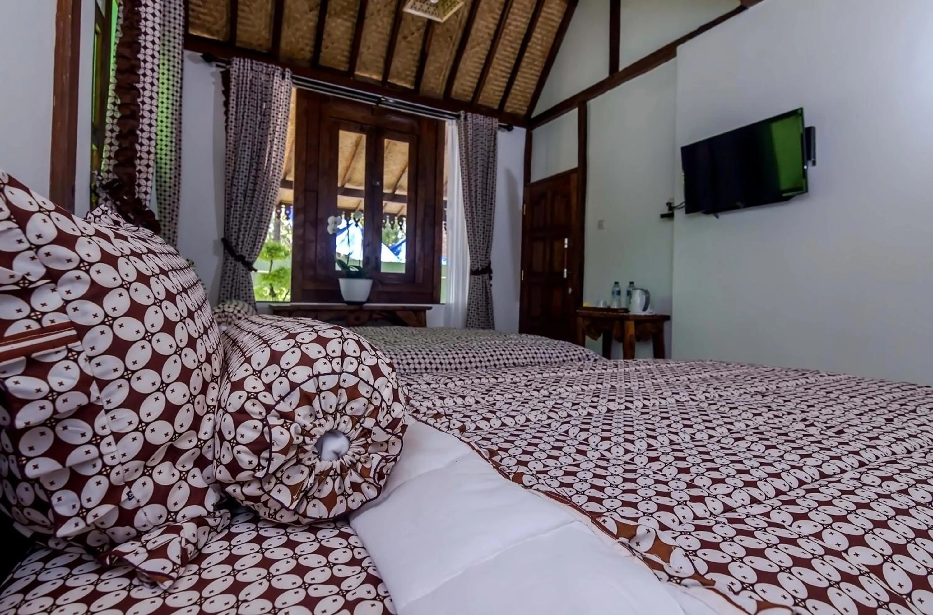 Bed in The Omah Borobudur