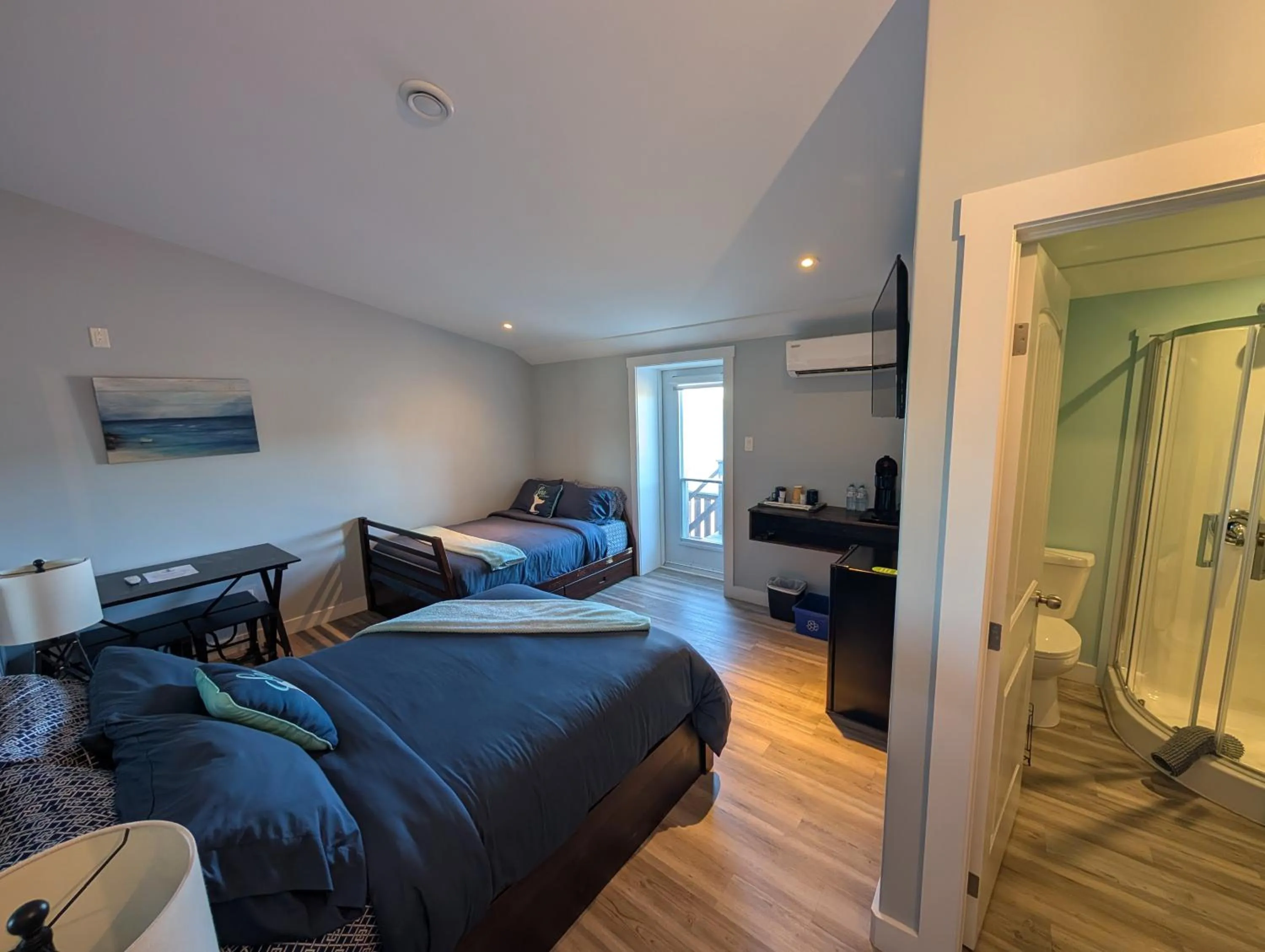 Bed in Dildo Boathouse Inn