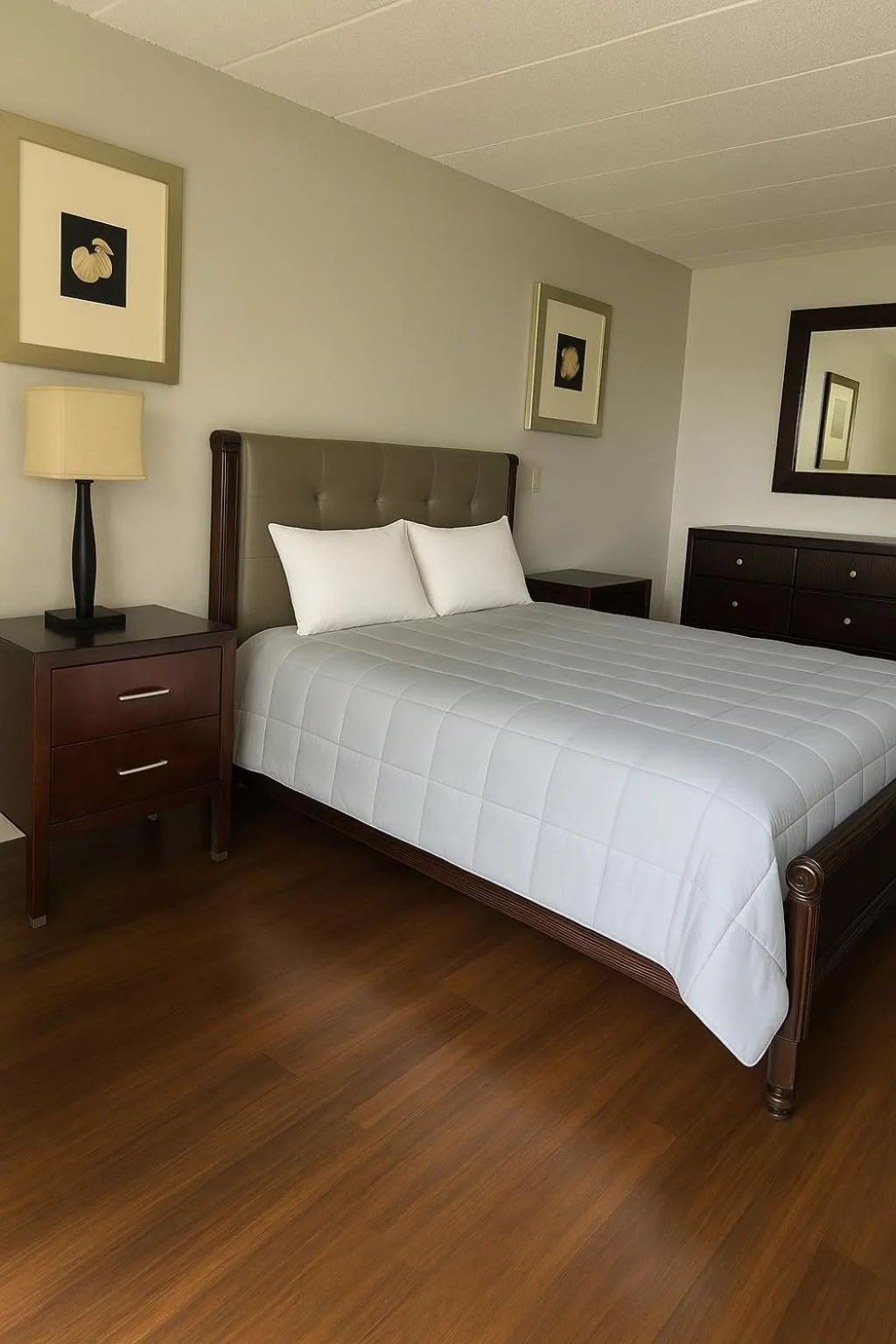 Bed in APM Inn and Suites