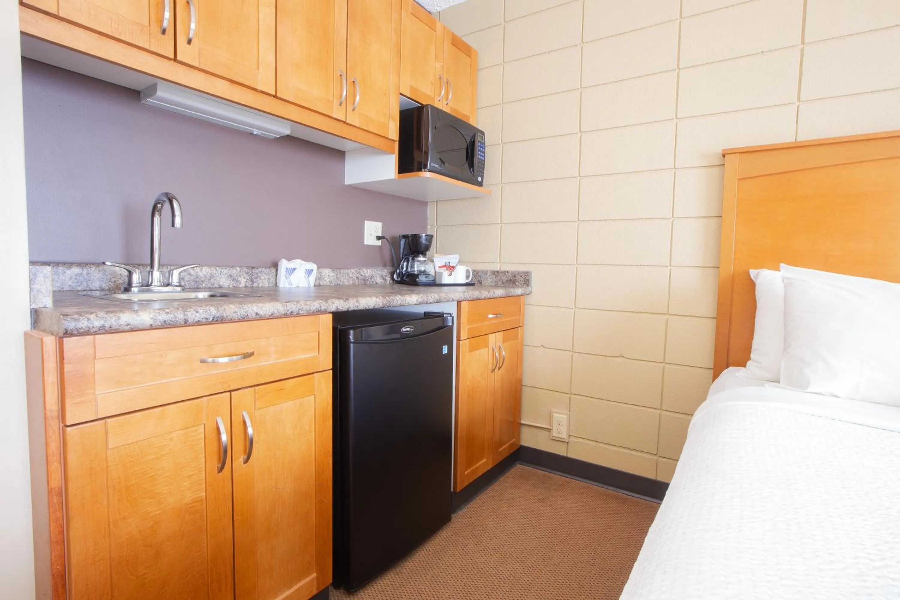 Bed in Neighbourhood Inn Hotels in Bonnyville