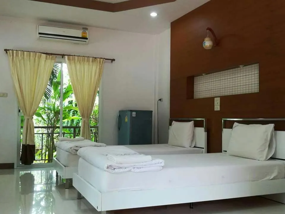 Bed in Pluluang Mansion