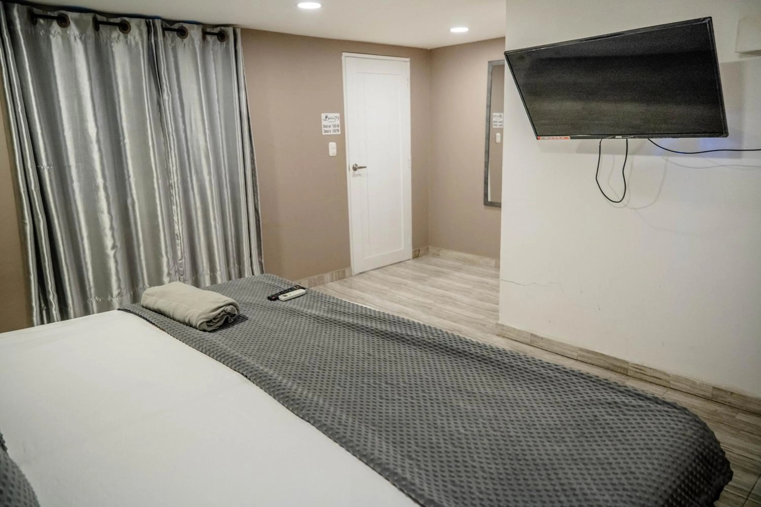 Bed in Bahia 79 Apartasuites Cerca al Centro