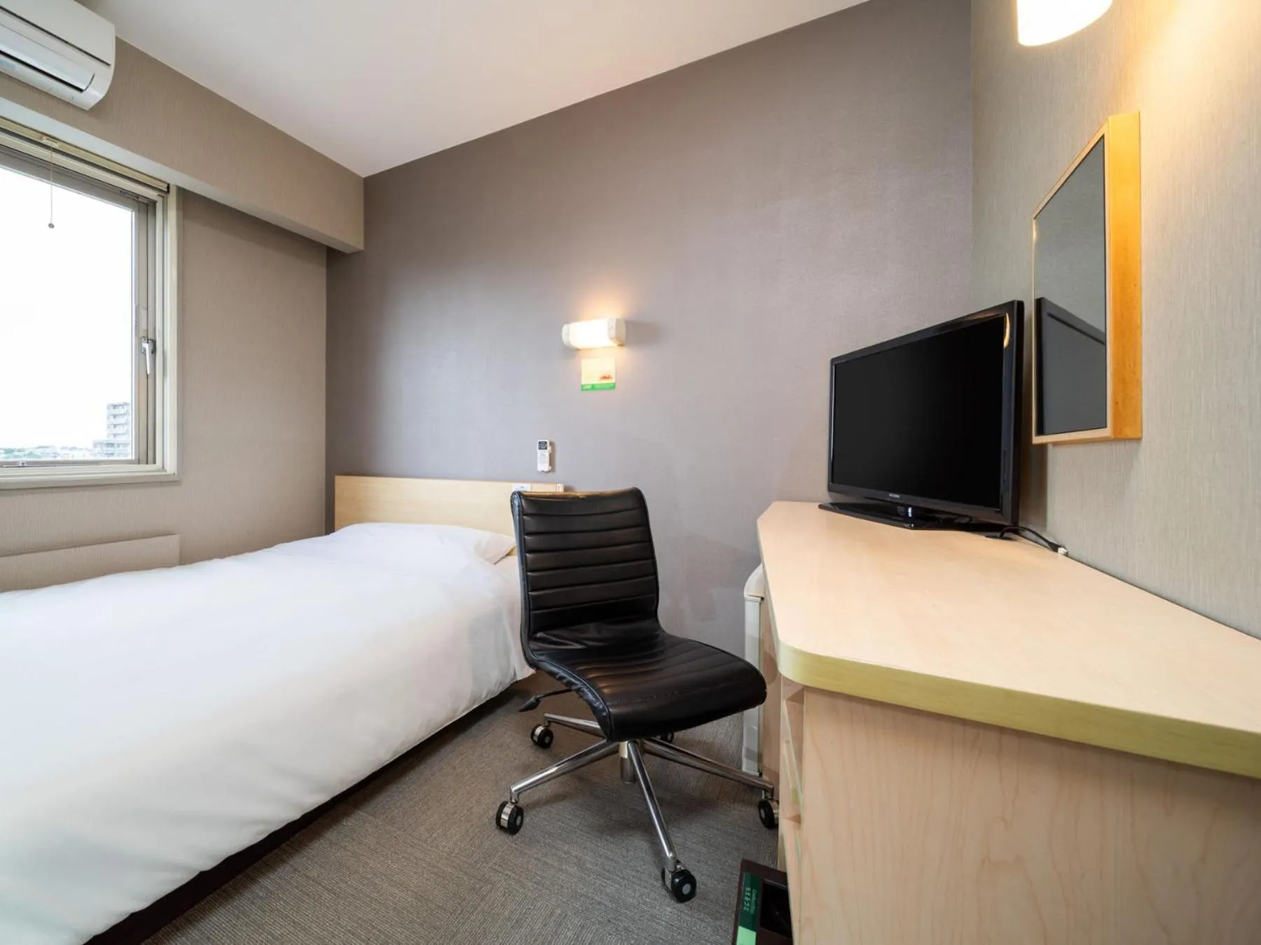 Bed in Super Hotel Fuji Inter