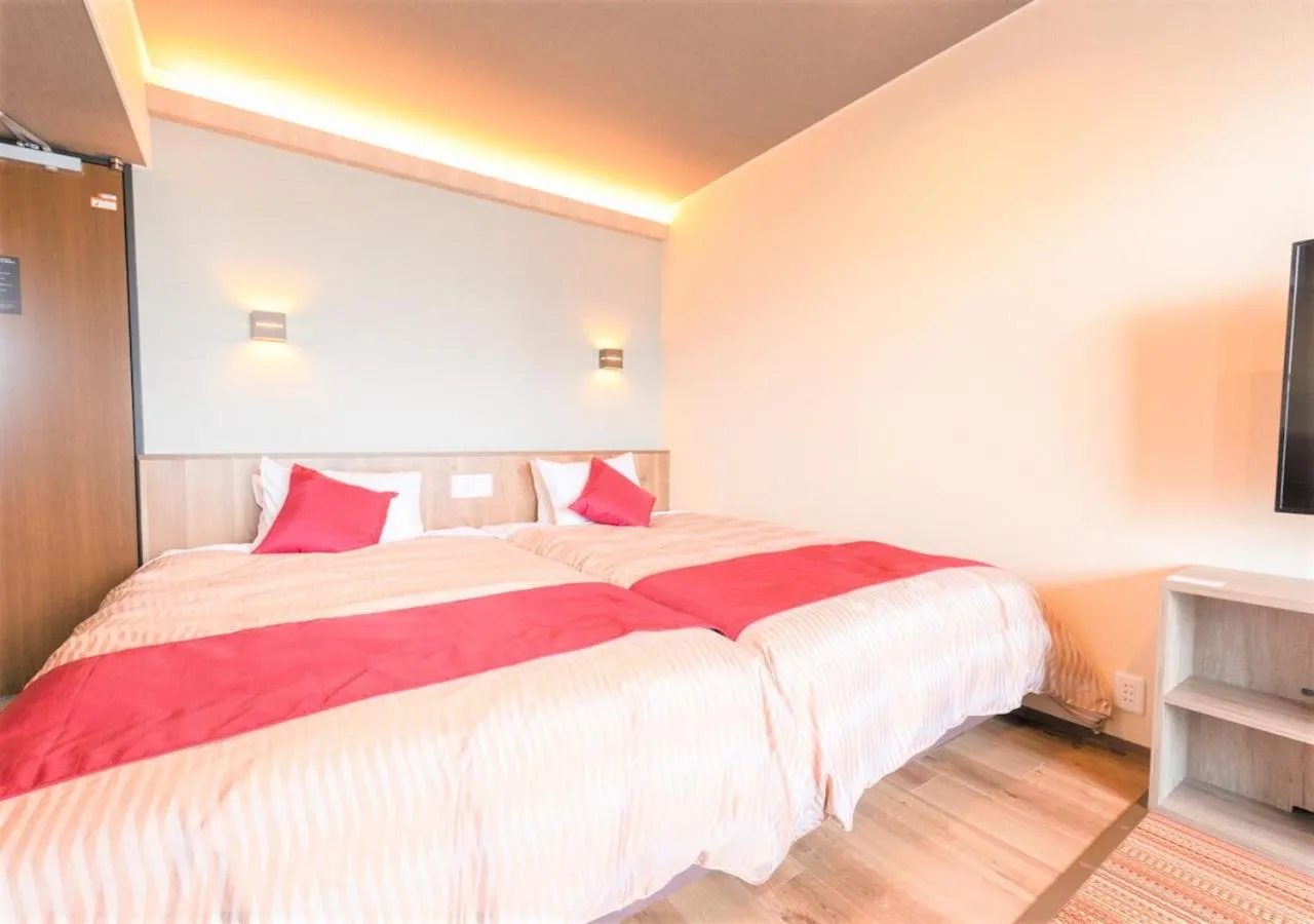 Bed in LiVEMAX RESORT Atami Sea Front
