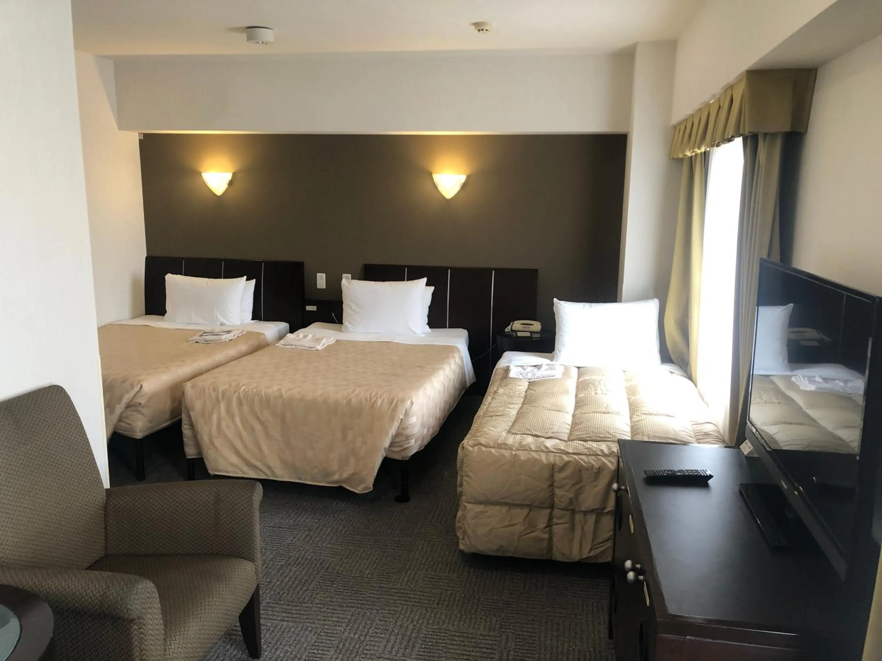 Photo of the whole room, Bed in GRG Hotel Naha