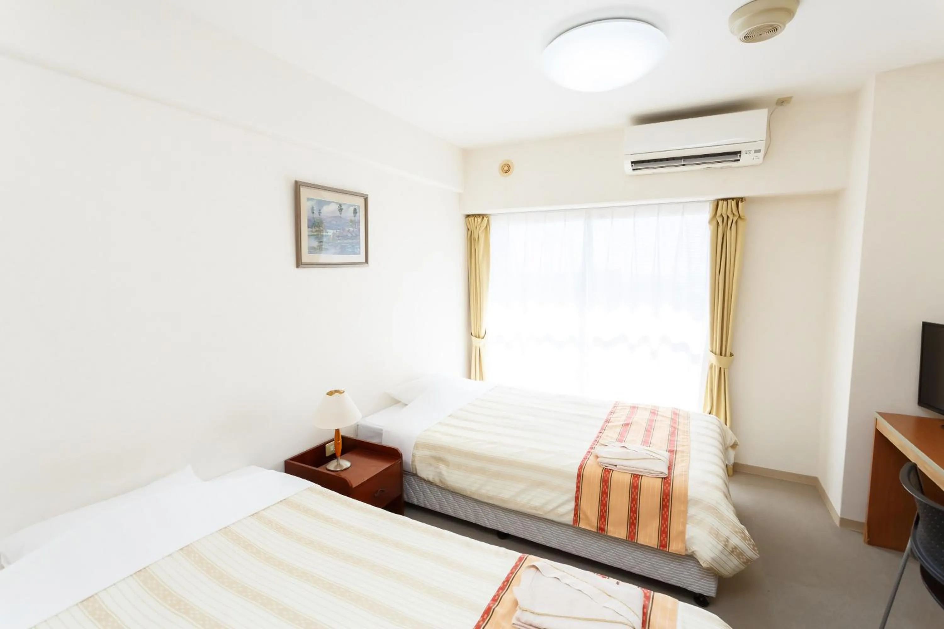 Photo of the whole room, Bed in Hotel Peace Island Ishigaki in Yashima