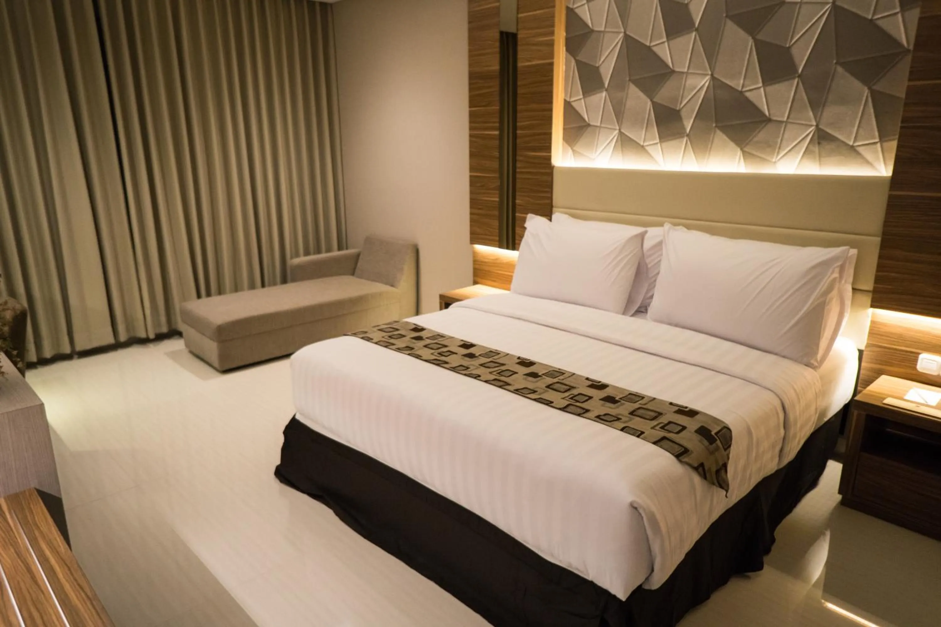 Photo of the whole room, Bed in Novena Hotel Bandung
