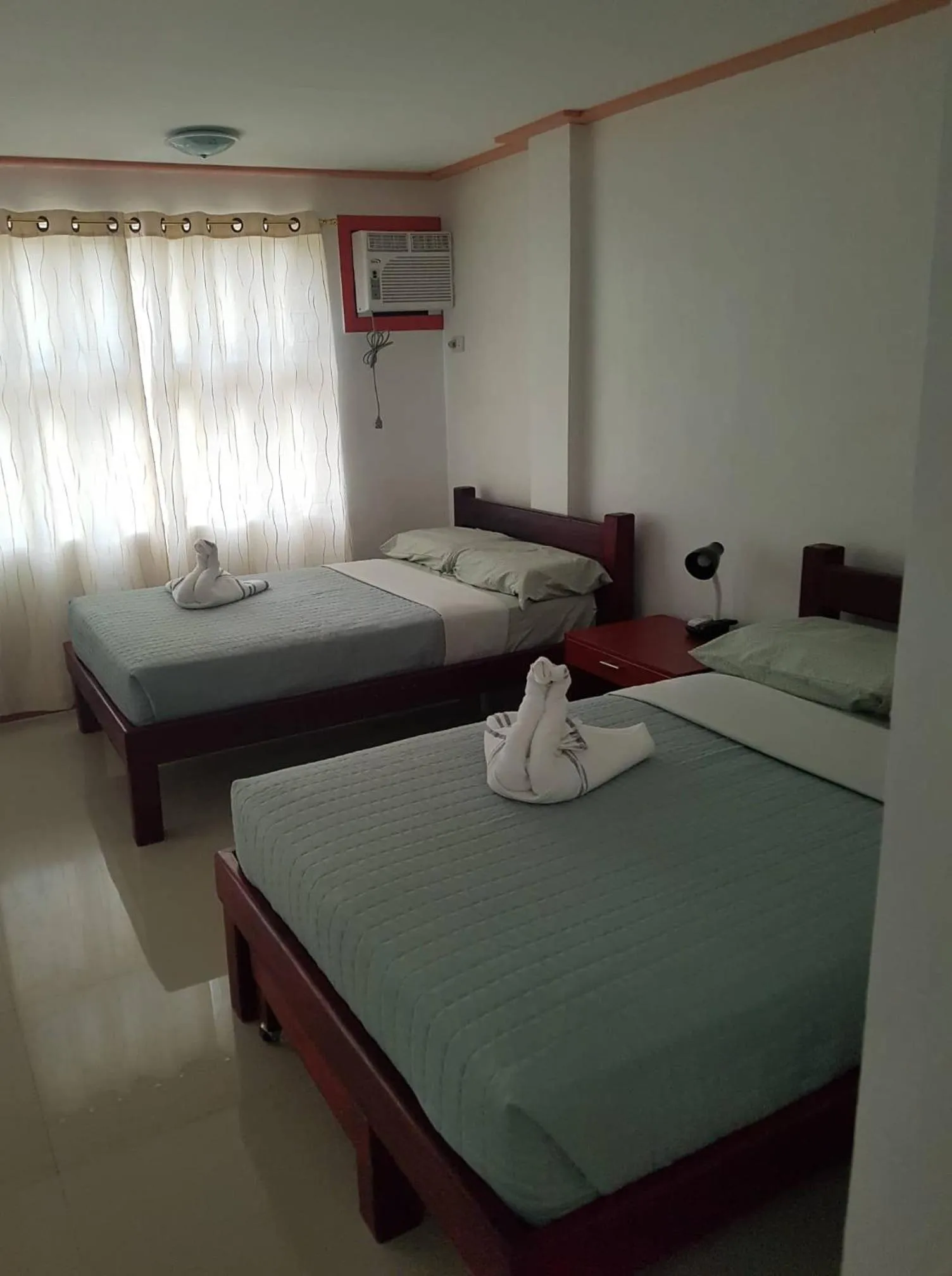 Bed in Catalina`s Inn family room