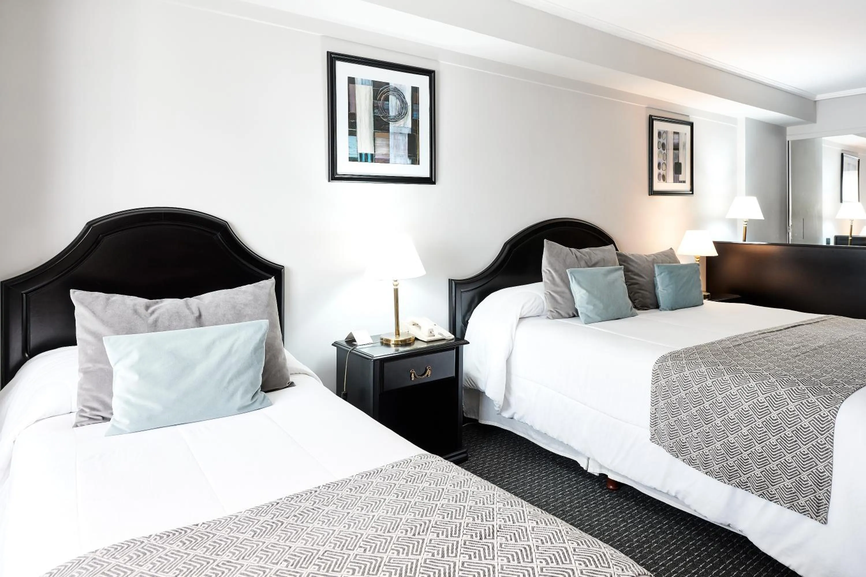 Bed in Plaza Real Suites Hotel