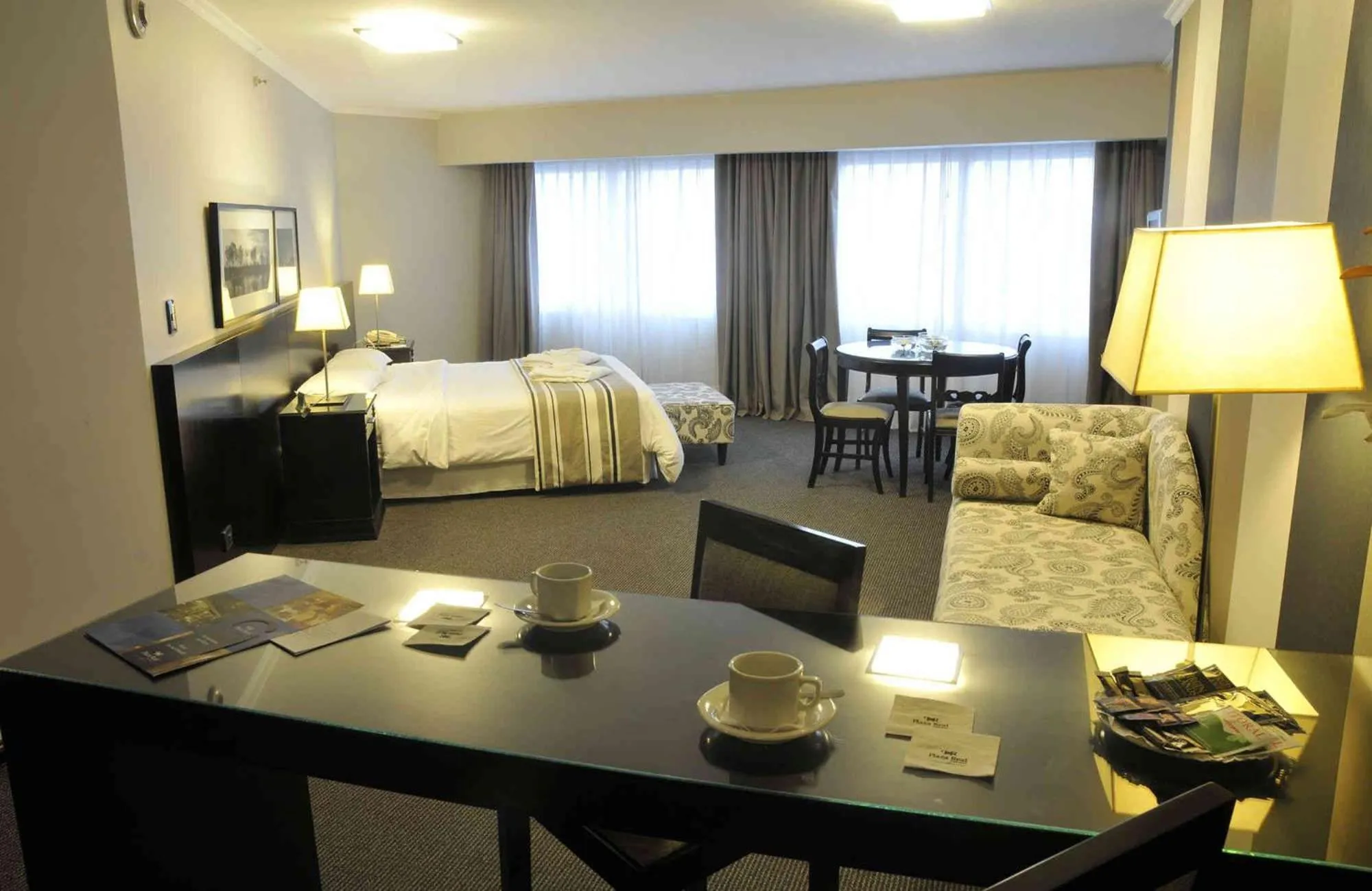 Photo of the whole room, Bed in Plaza Real Suites Hotel