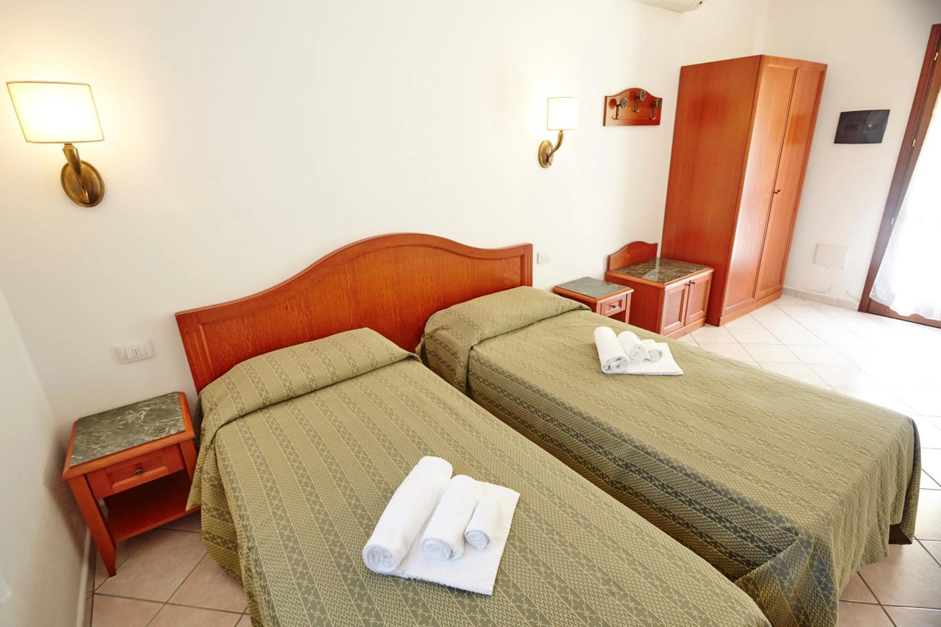 Property building, Bed in Hotel Cala Mirto