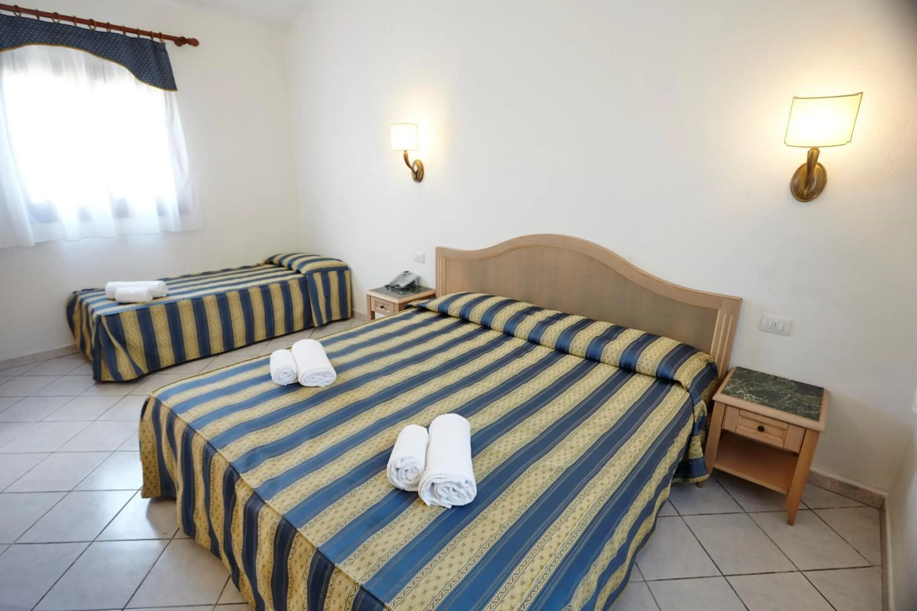 Classic Triple Room in Hotel Cala Mirto Classic Triple Room in Hotel Cala Mirto