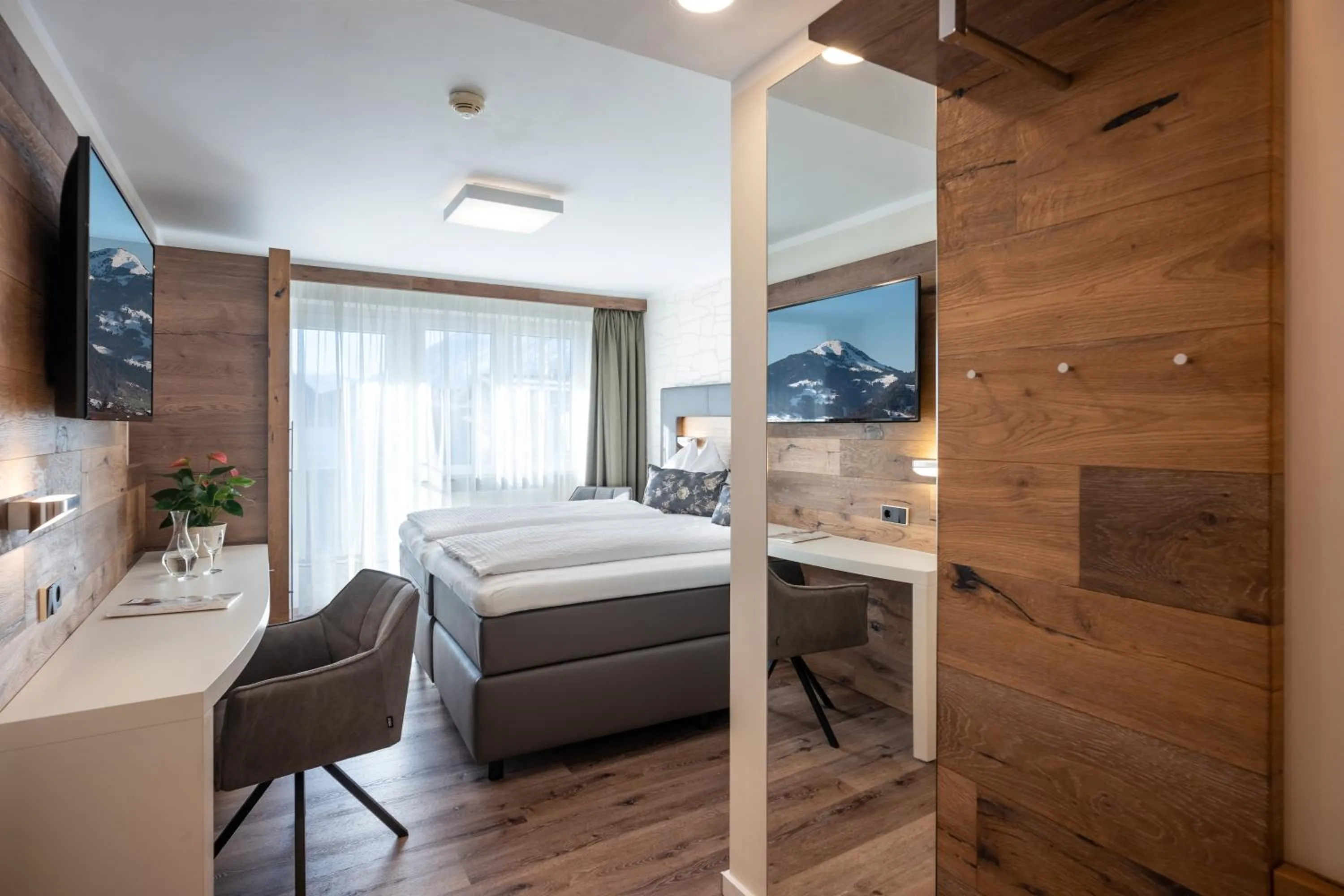 Photo of the whole room, Bed in Hotel Baumgarten & Chalet Baumgarten