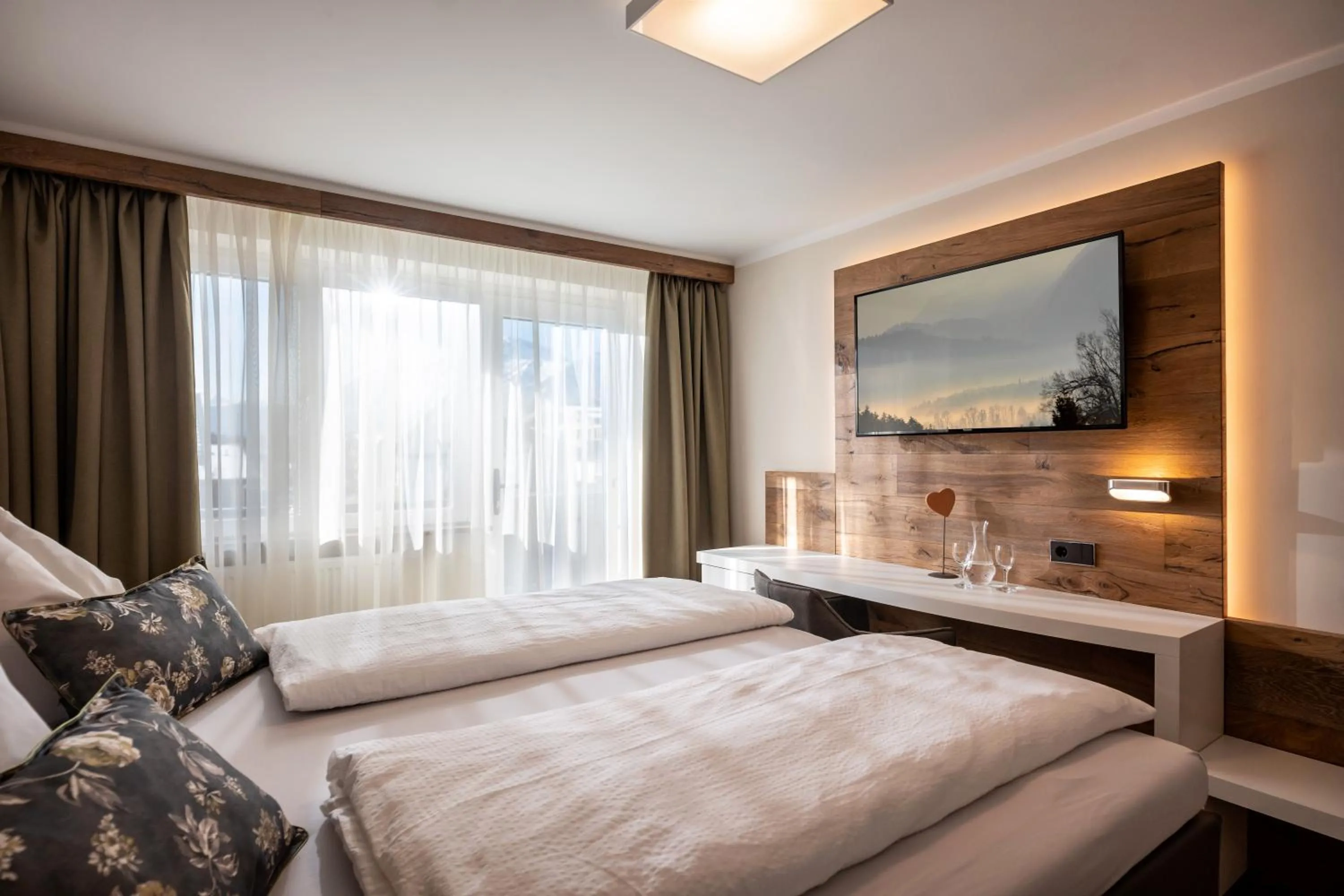 Bed in Hotel Baumgarten & Chalet Baumgarten