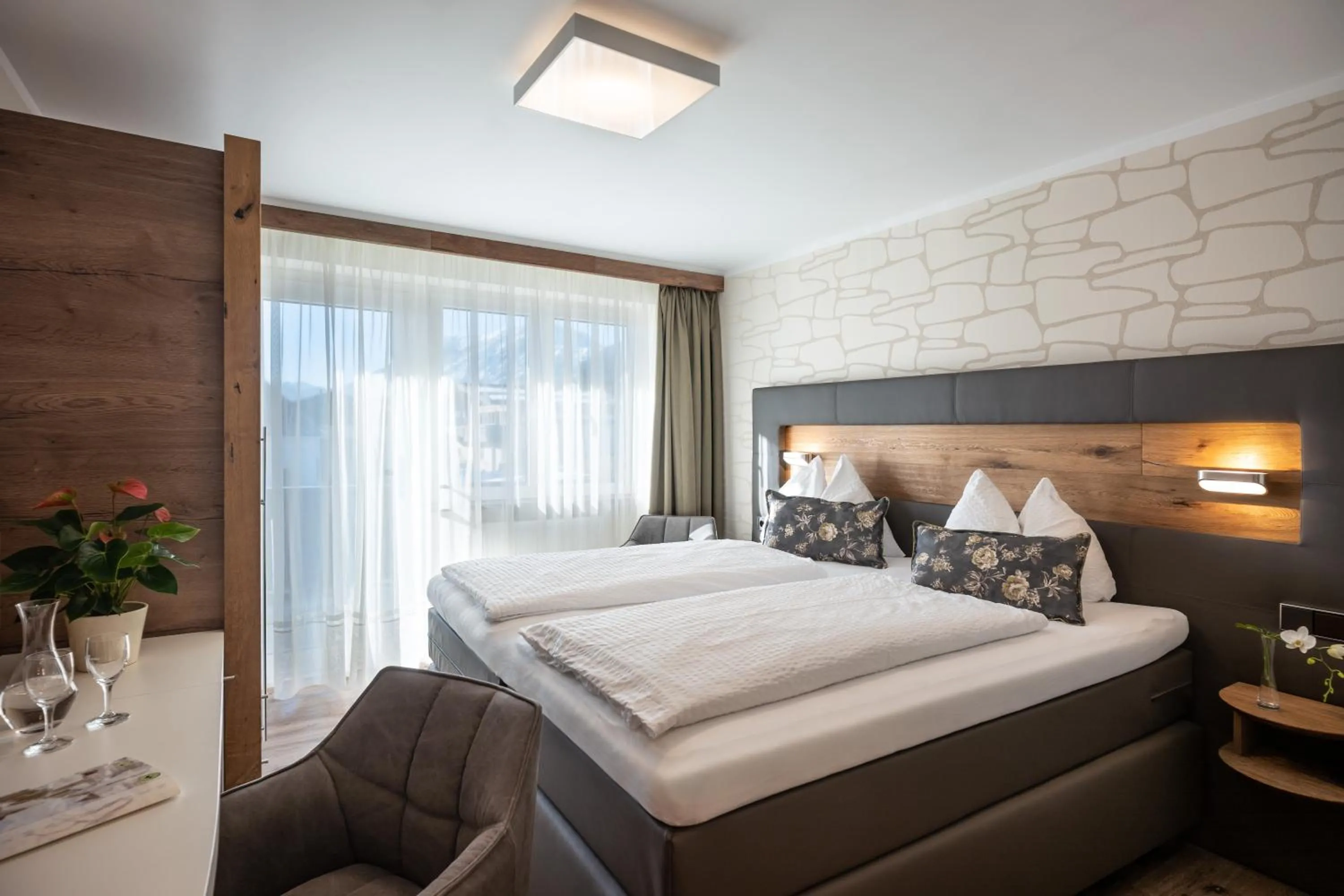Bed in Hotel Baumgarten & Chalet Baumgarten