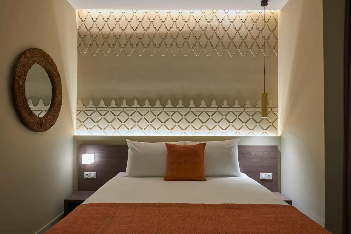 Bed in M Suite Hotel