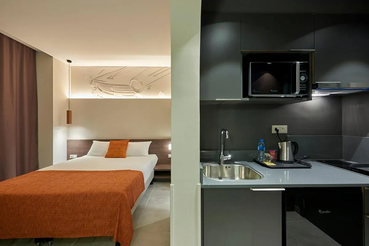 Bed in M Suite Hotel