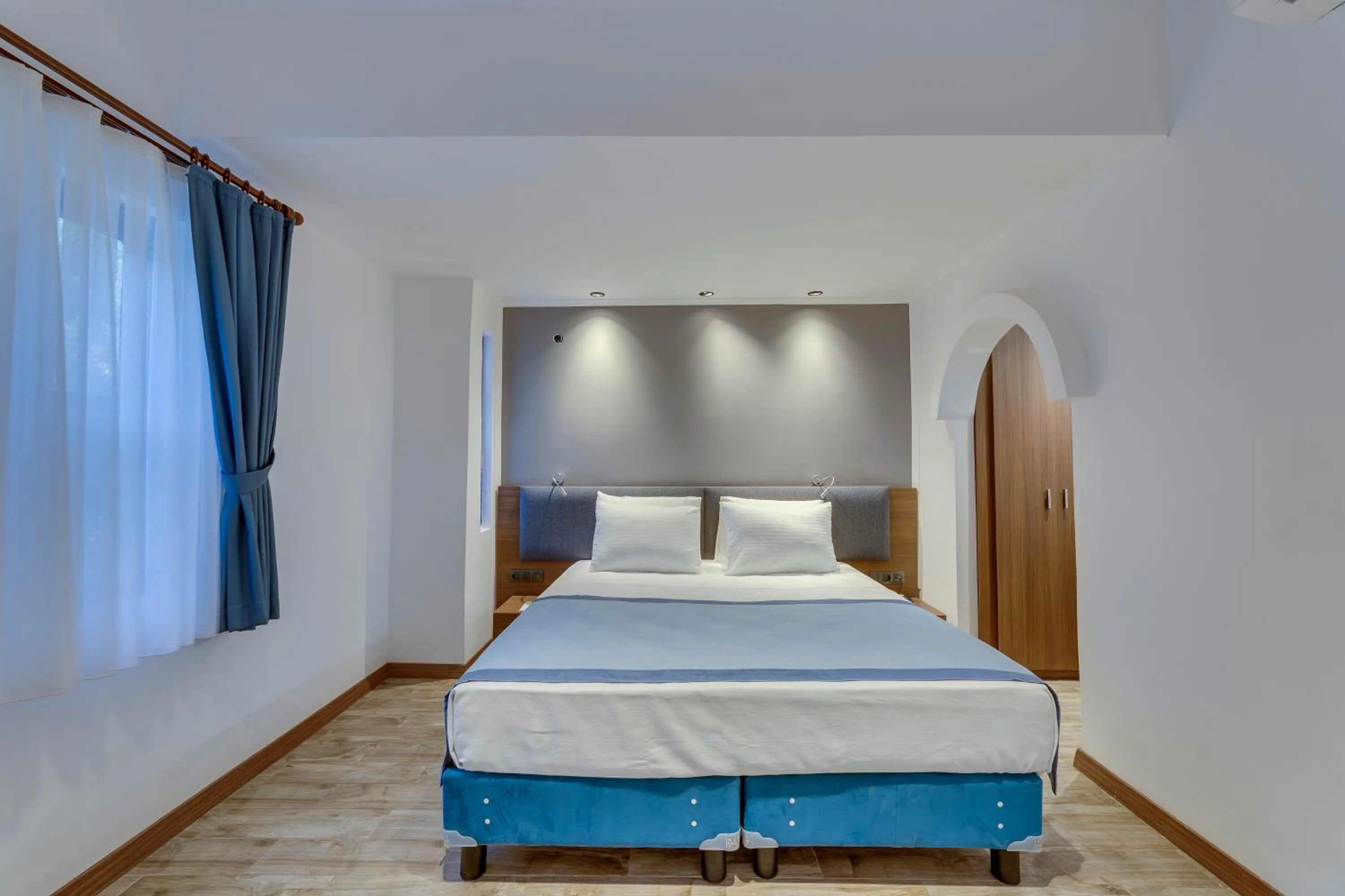 Bed in Risus Garden Marina Hotel