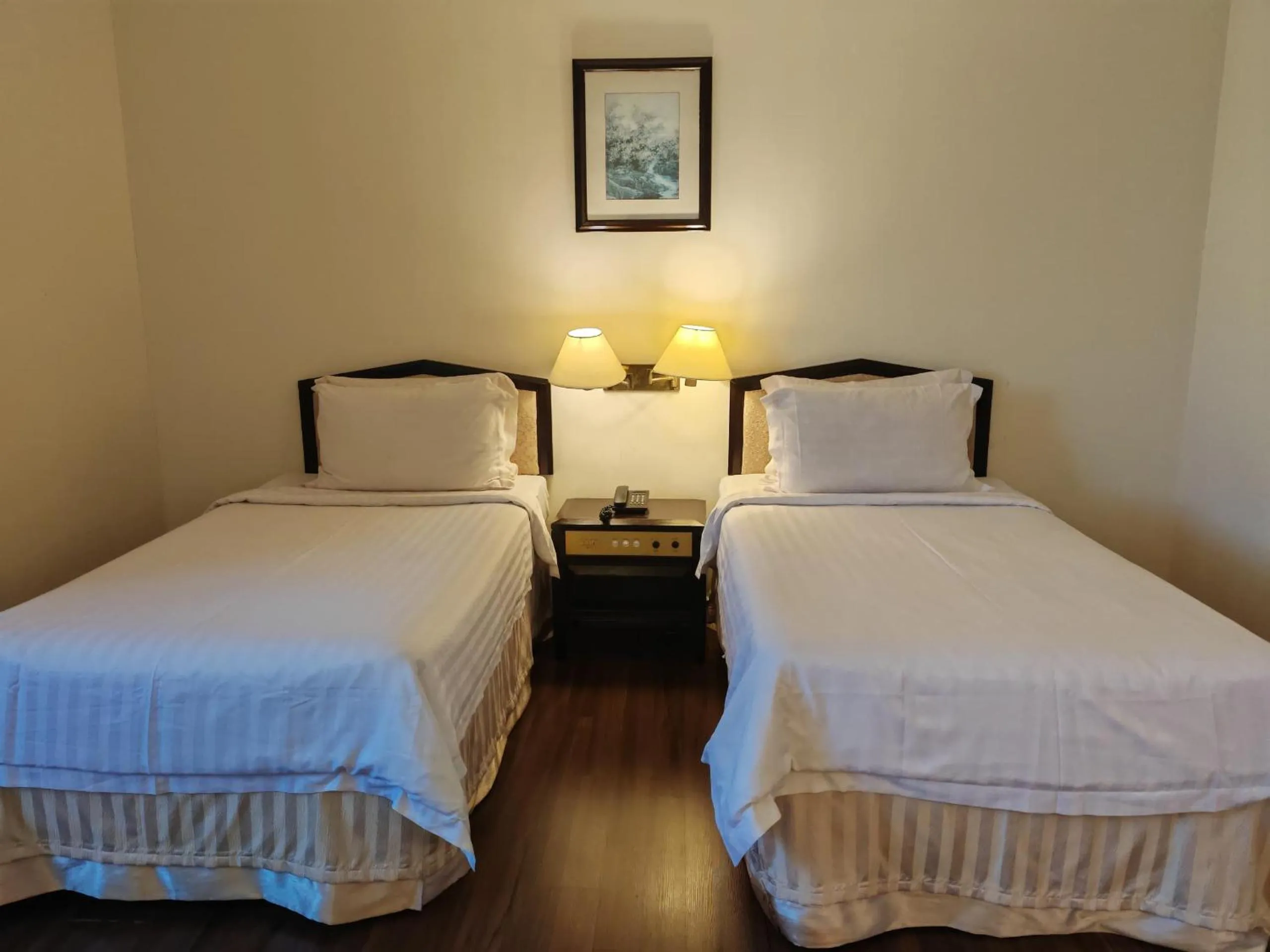 Bed in The Putra Regency Hotel