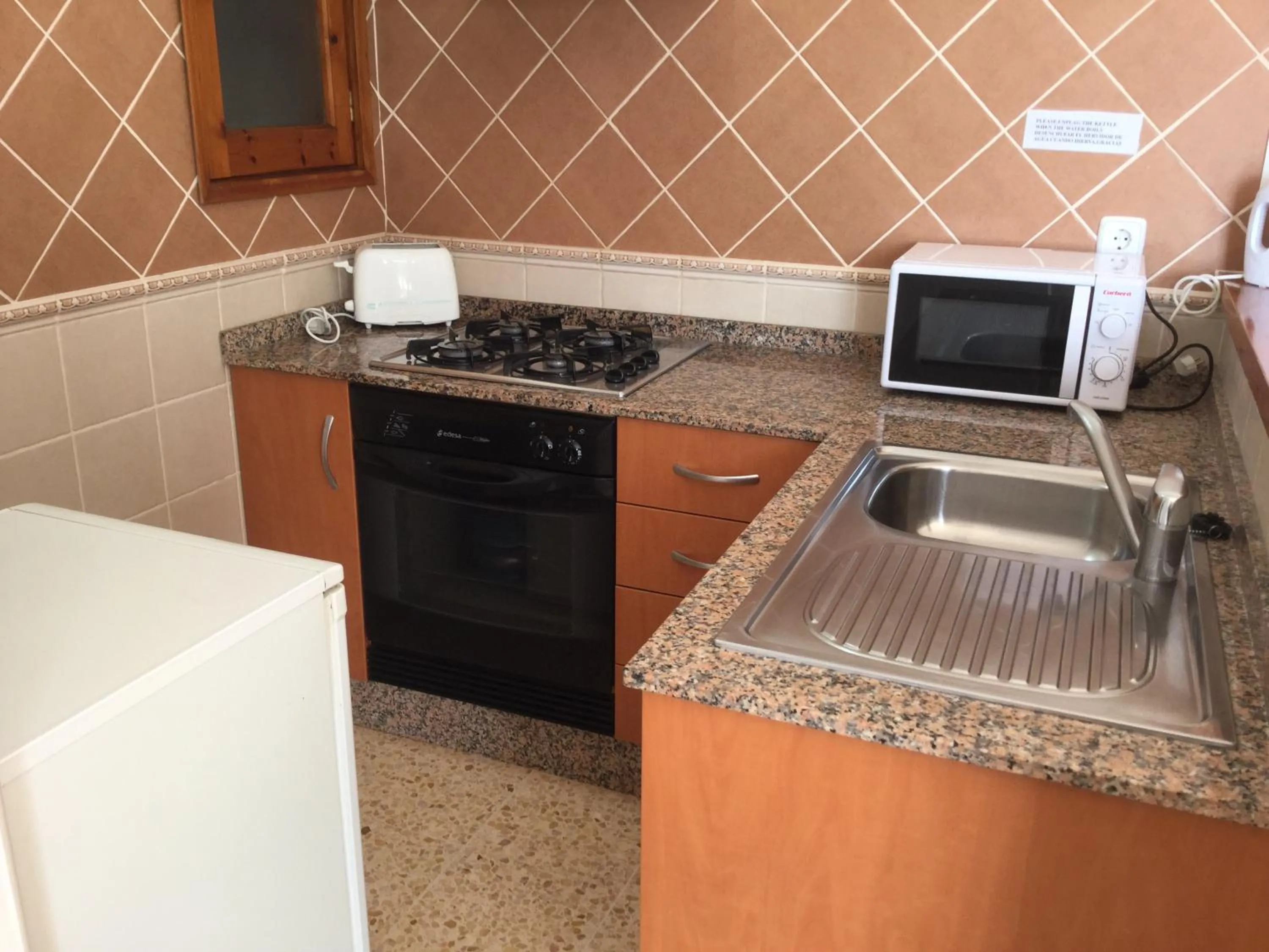 Kitchen or kitchenette in Apartamentos Alba